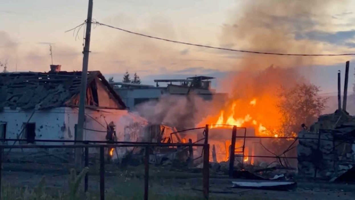 A view shows a building on fire in the town of Sudzha following an incursion of Ukrainian troops into the Kursk region, Russia, in this still image from video taken August 7, 2024. MIC Izvestia