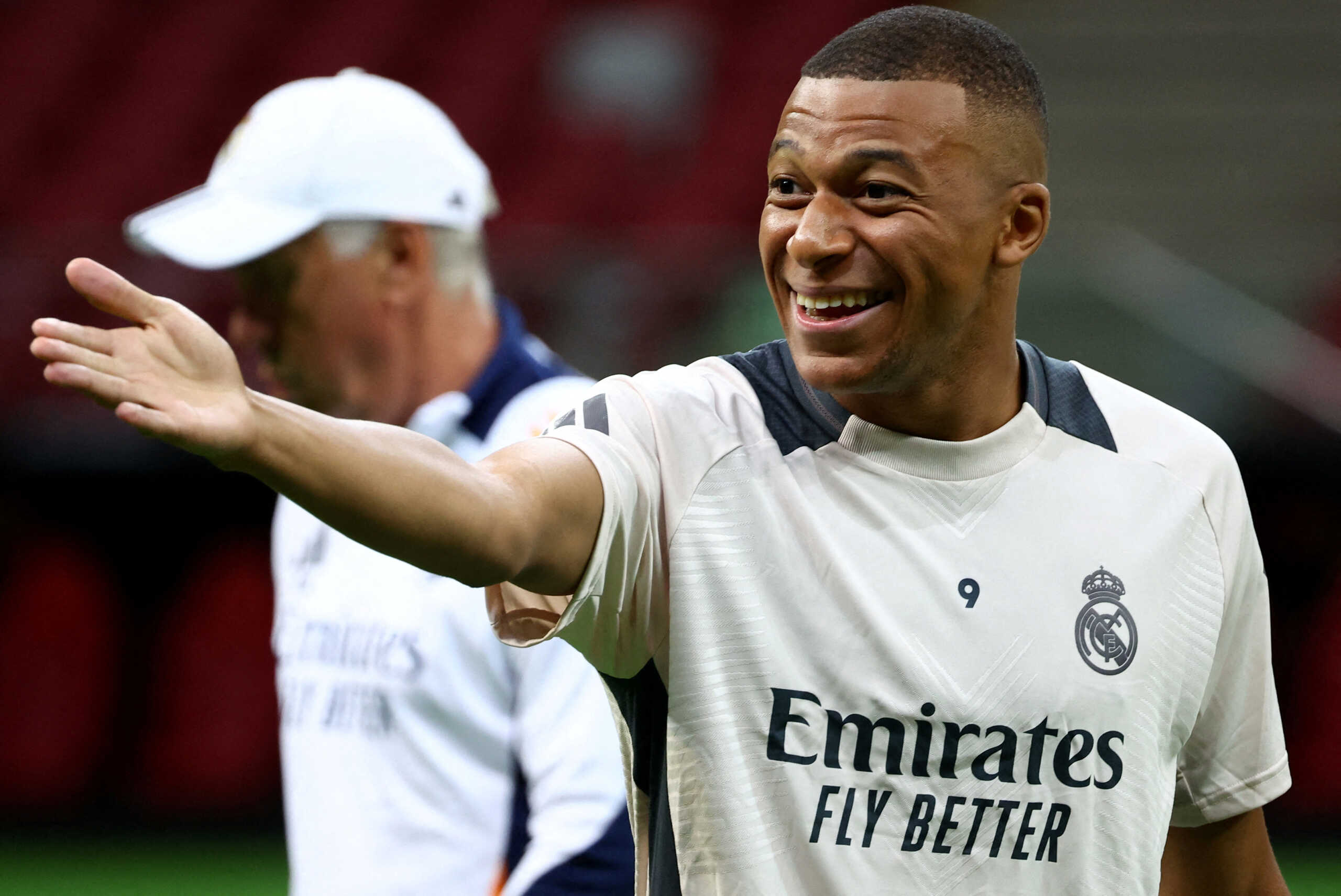 Soccer Football - UEFA Super Cup - Real Madrid Training - National Stadium, Warsaw, Poland - August 13, 2024 Real Madrid's Kylian Mbappe with coach Carlo Ancelotti during training REUTERS