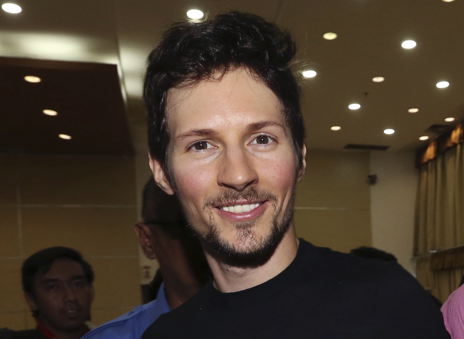 FILE - In this Aug. 1, 2017 file photo, Telegram co-founder Pavel Durov, center, smiles following his meeting with Indonesian Communication and Information Minister Rudiantara in Jakarta, Indonesia. Russia's top court has ruled that the Telegram messaging app can be forced to provide user data to security services. (AP Photo