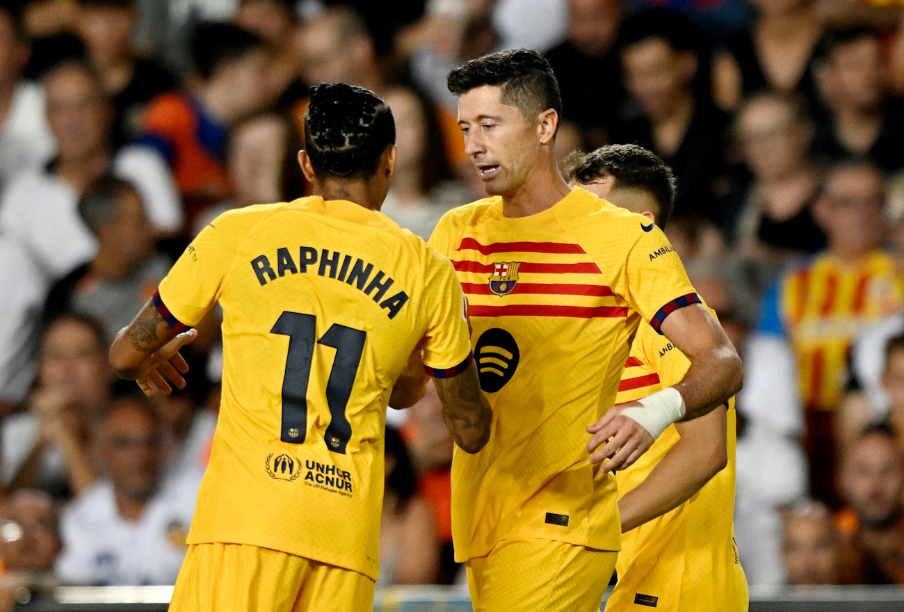 Soccer Football - LaLiga - Valencia v FC Barcelona - Estadio de Mestalla, Valencia, Spain - August 17, 2024 FC Barcelona's Robert Lewandowski celebrates scoring their second goal with FC Barcelona's Raphinha REUTERS