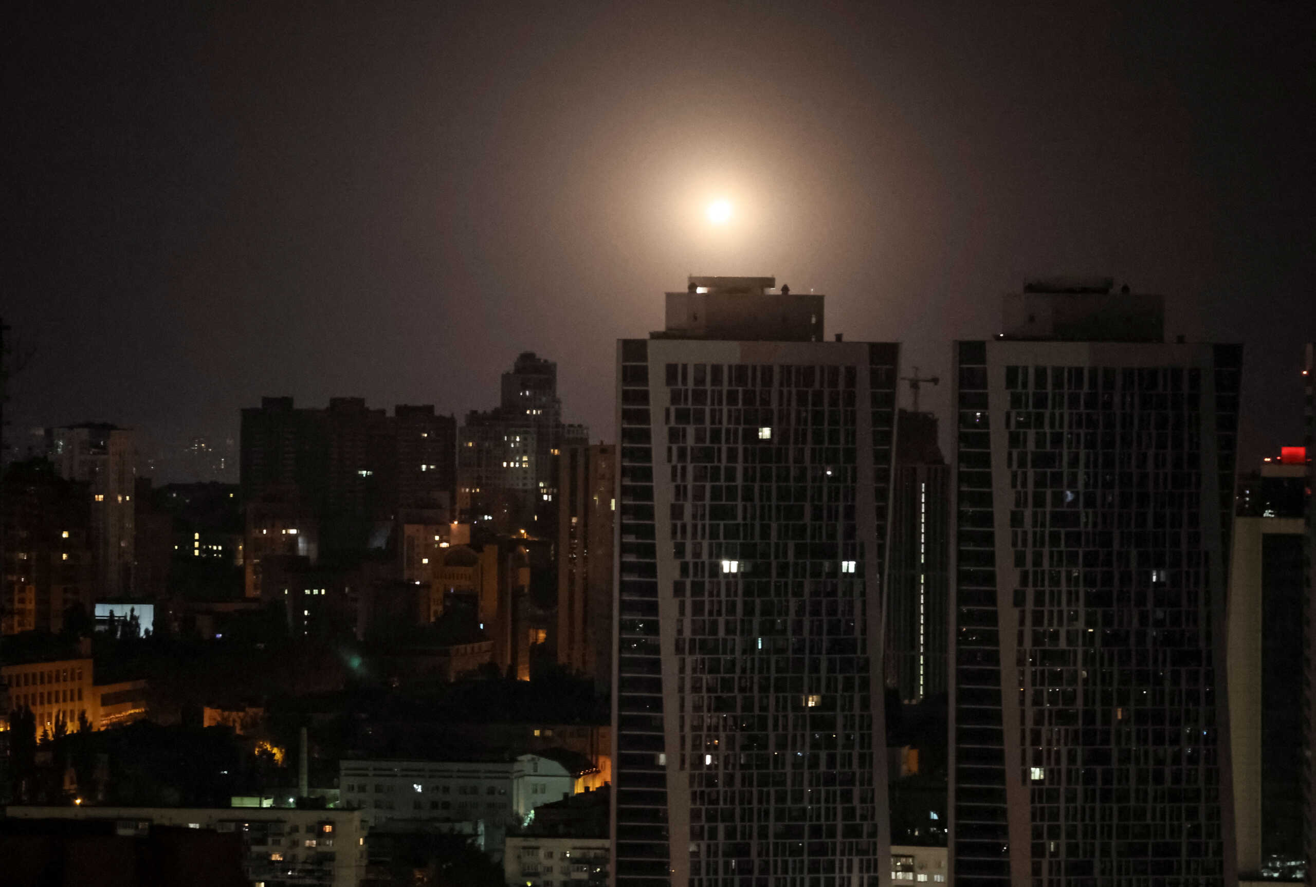 An explosion is seen in the sky over the city during a Russian missile and drone strike, amid Russia's attack on Ukraine, in Kyiv, Ukraine August 11, 2024. REUTERS