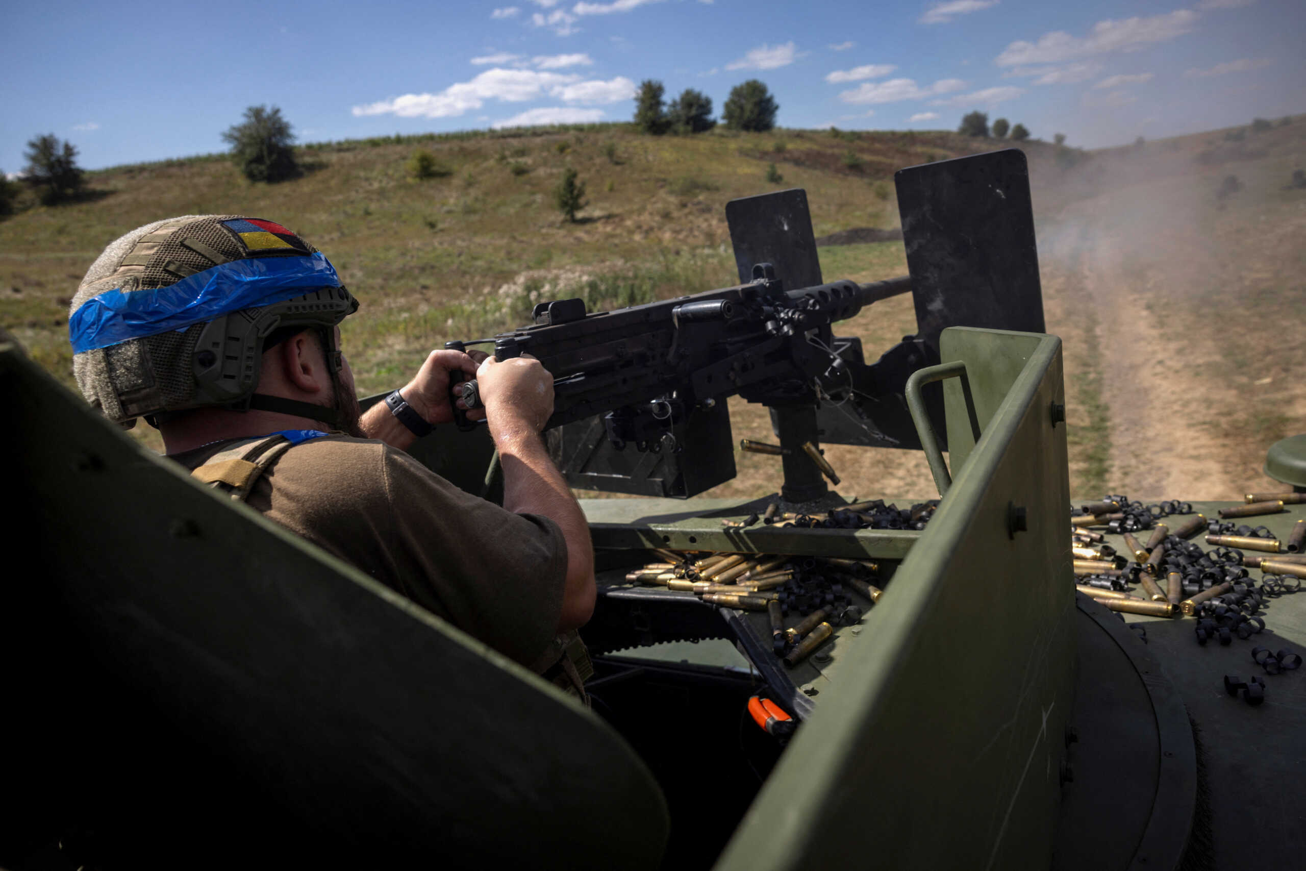 A soldier of Ukraine's 22nd Separate Mechanised Brigade shoots a Browning machine gun mounted to a Humvee military vehicle during an exercise in the Sumy region near the Russian border, amid Russia's attack on Ukraine, August 17, 2024.  REUTERS