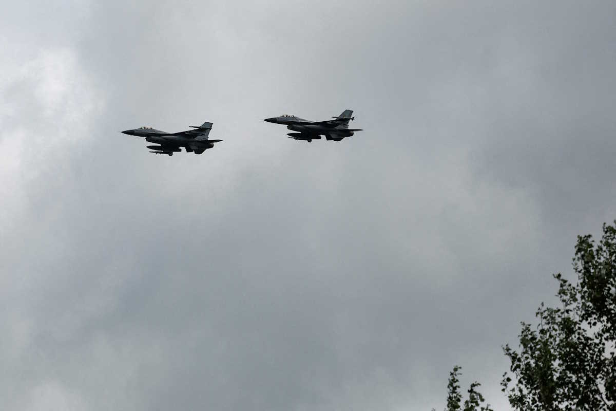 FILE PHOTO: Ukrainian F-16 fighting aircrafts are seen in the air during marking the Day of the Ukrainian Air Forces, amid Russia's attack on Ukraine, in an undisclosed location, Ukraine August 4, 2024. REUTERS