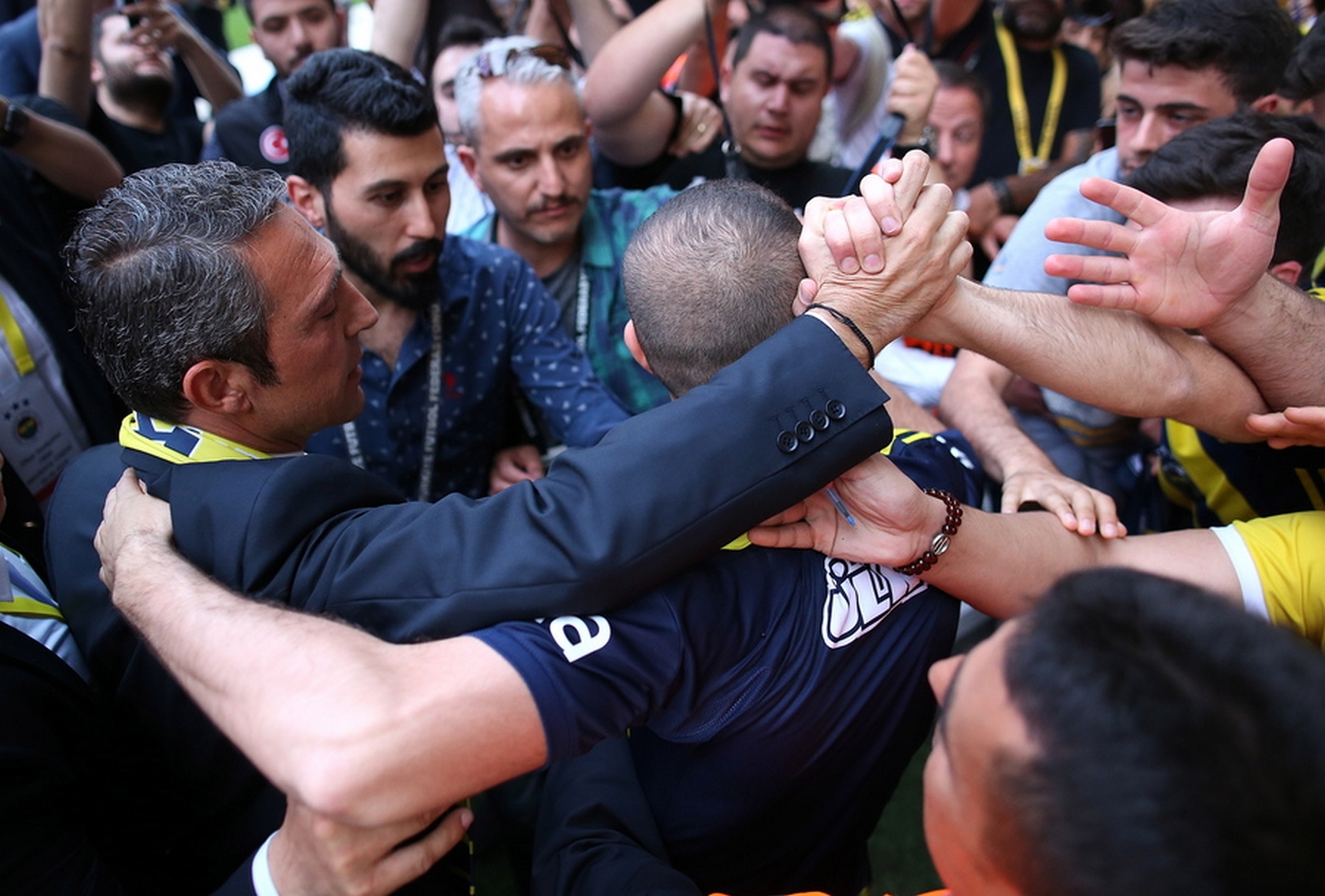 epa06787339 New president of Turkish soccer club Fenerbahce, Ali Koc (L), who took over the position after winning the election against former president Aziz Yildirim, shake hands with fans during a ceremony at Sukru Saracoglu stadium in Istanbul, Turkey, 05 June 2018.  EPA