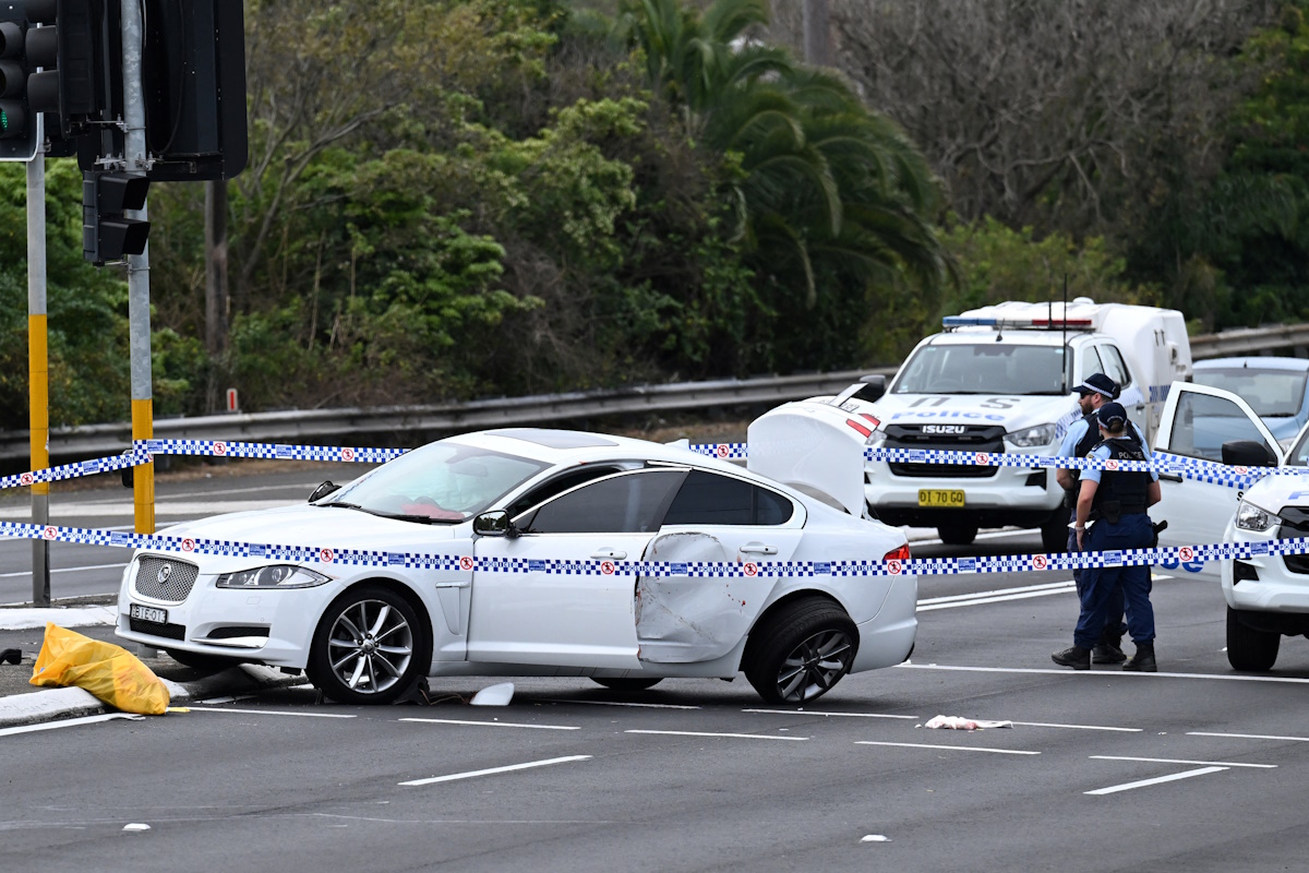 A damaged vehicle is cordoned off by the police after a two-vehicle crash in Engadine, Sydney, Australia August 25, 2024. Emergency services responded to an incident at Engadine where four people including a police officer have been injured following a crash and suspected stabbing. AAP Image