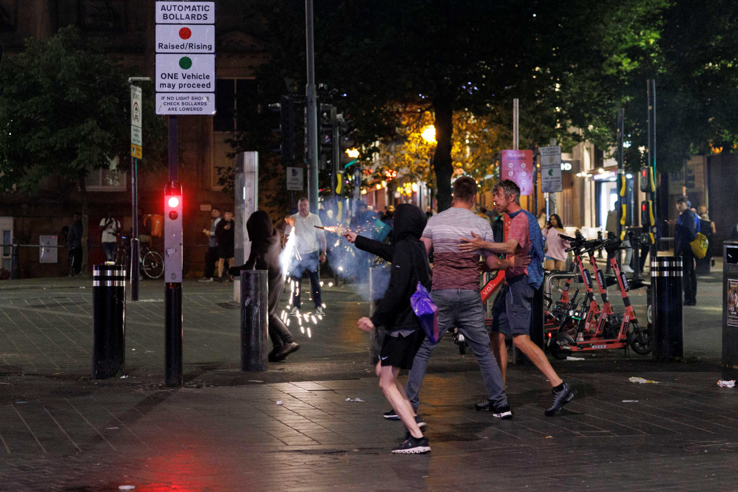 Protestors throw fireworks as the riots continue into the night in Liverpool, Britain, August 3, 2024. REUTERS