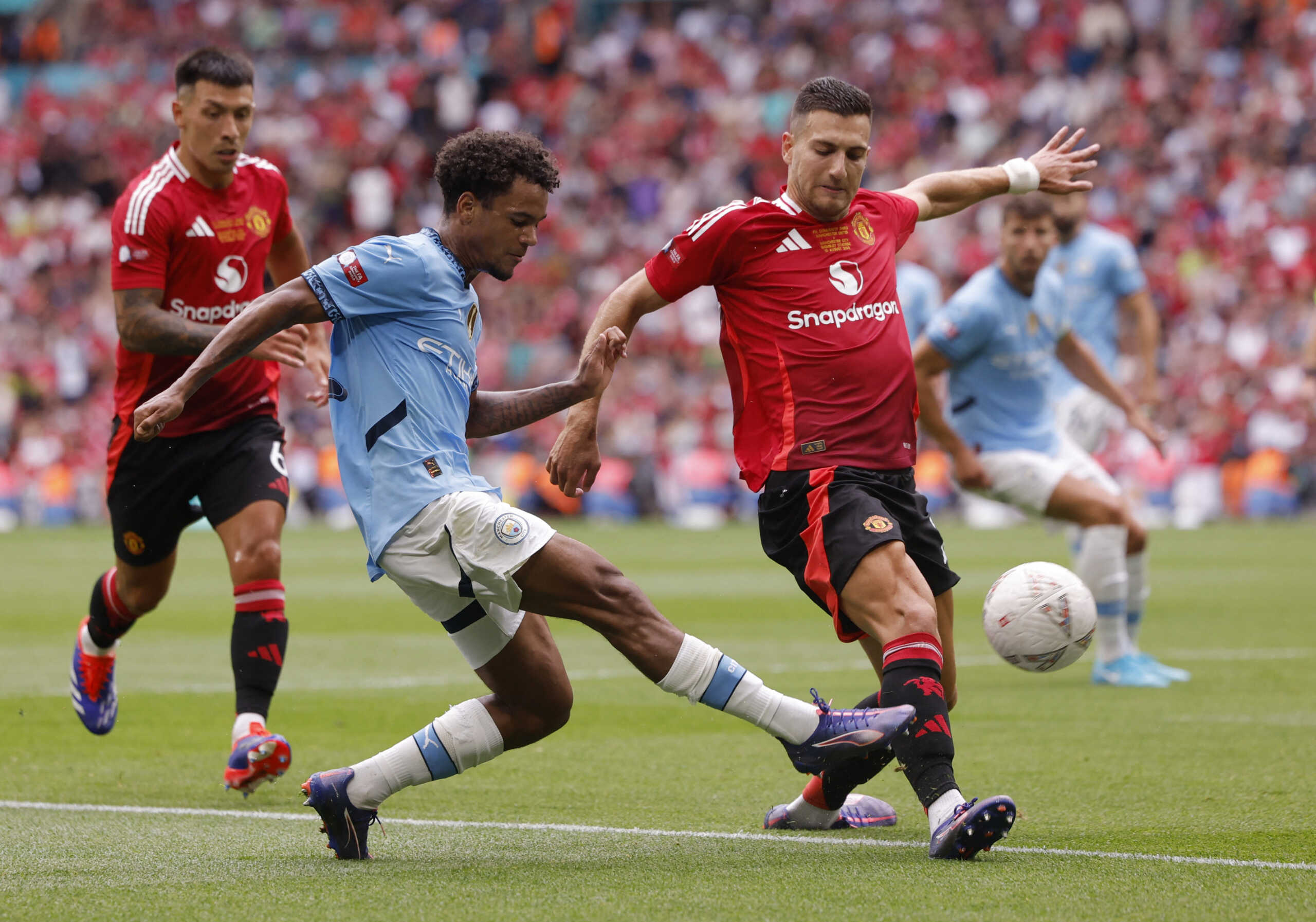 Soccer Football - Community Shield - Manchester United v Manchester City - Wembley Stadium, London, Britain - August 10, 2024 Manchester City's Oscar Bobb in action with Manchester United's Diogo Dalot Action Images via Reuters
