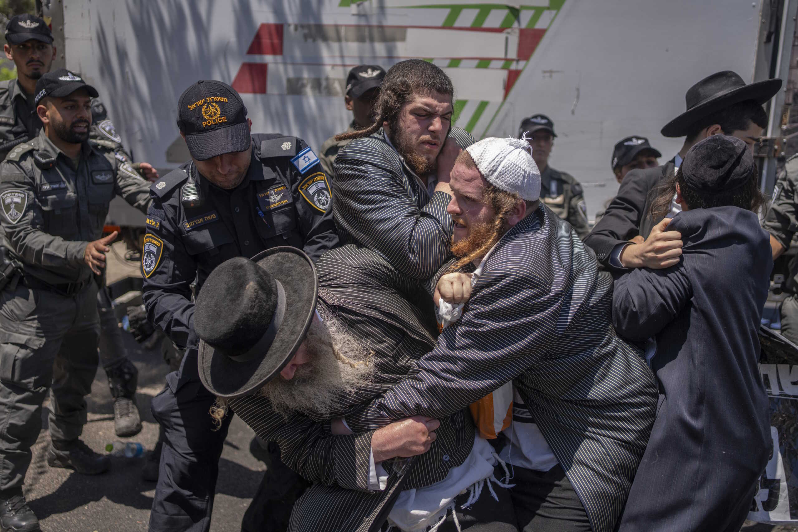 05 August 2024, Israel, Tel Hashomer: Ultra orthodox Jews clash with the police at the entrance to Tel Hashomer, central recruitment center of Israeli Defence Forces. 05 August is the first recruitment day for the orthodox as Israeli court has decided. Photo by: Ilia Yefimovich