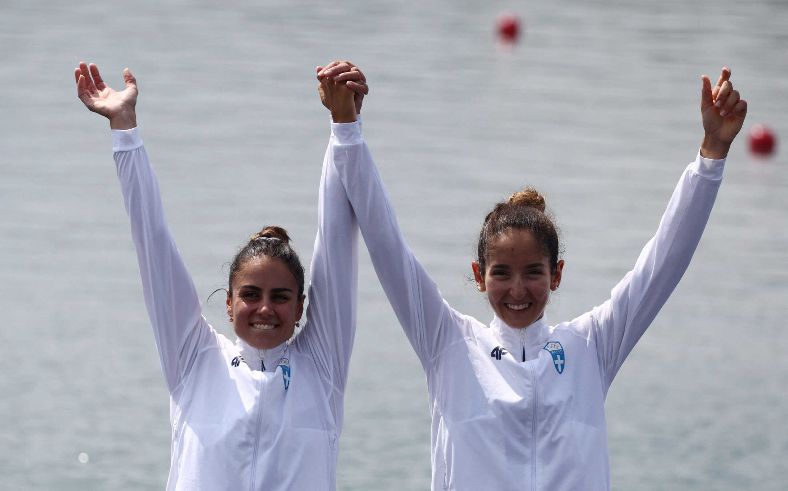 Paris 2024 Olympics - Rowing - LWT Women's Dbl Sculls Victory Ceremony - Vaires-sur-Marne Nautical Stadium - Flatwater, Vaires-sur-Marne, France - August 02, 2024. Bronze medalists Zoi Fitsiou of Greece and Dimitra Kontou of Greece celebrate on the podium. REUTERS