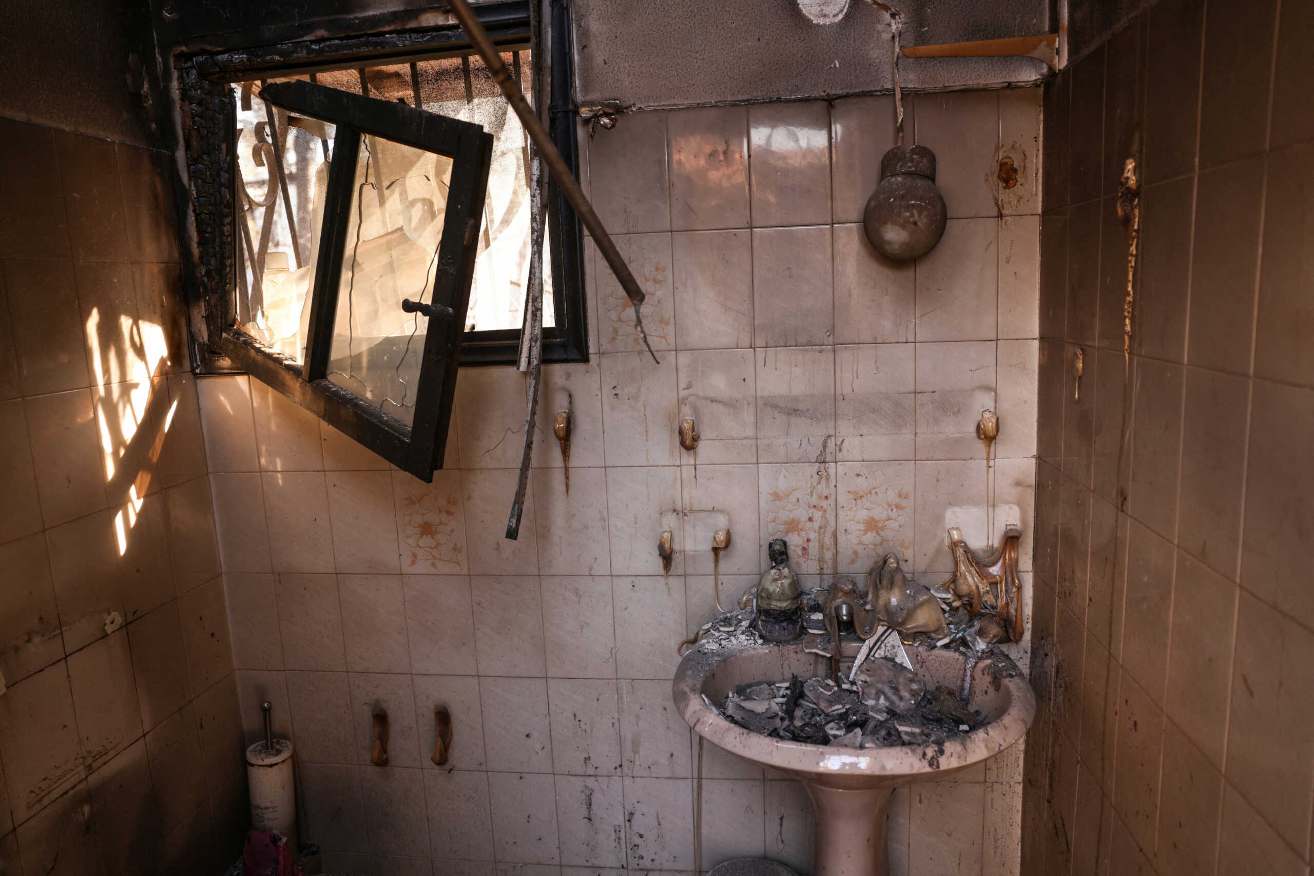A view inside a burned out house, following the wildfire in Halandri suburb in Athens, Greece,  August 13, 2024. REUTERS