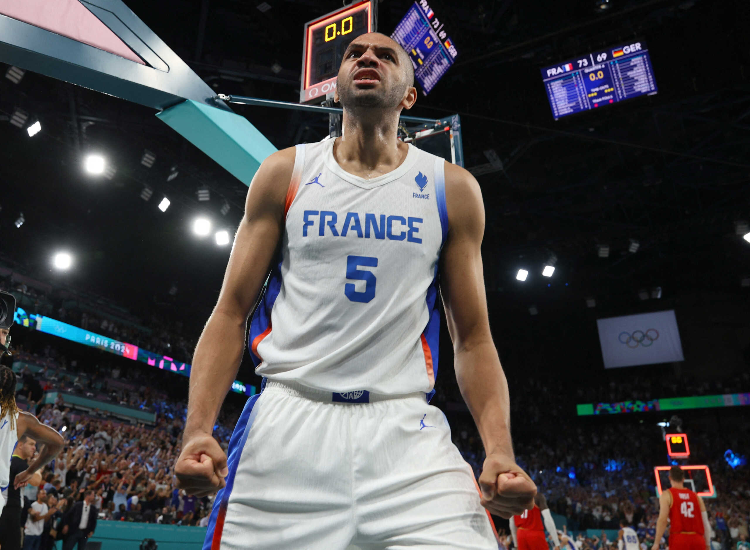 Paris 2024 Olympics - Basketball - Men's Semifinal - France vs Germany - Bercy Arena, Paris, France - August 08, 2024. Nicolas Batum of France celebrates after France win the semifinal. REUTERS