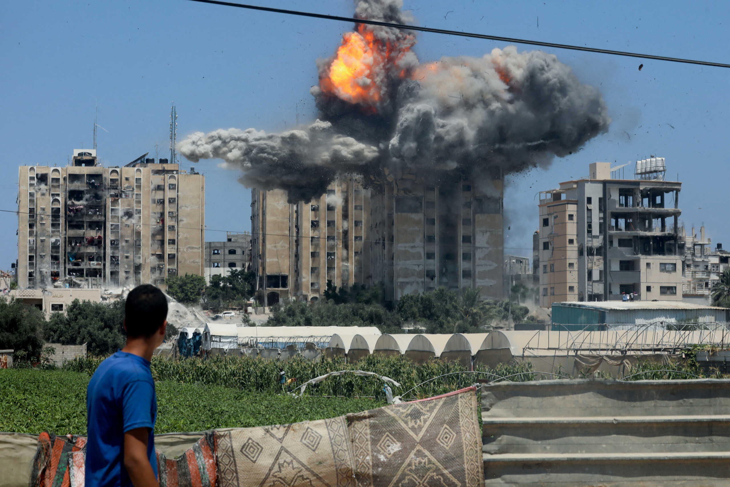 An explosion occurs following an Israeli air strike on a residential building, amid the Israel-Hamas conflict, in Nuseirat in the central Gaza Strip, July 20, 2024. REUTERS
