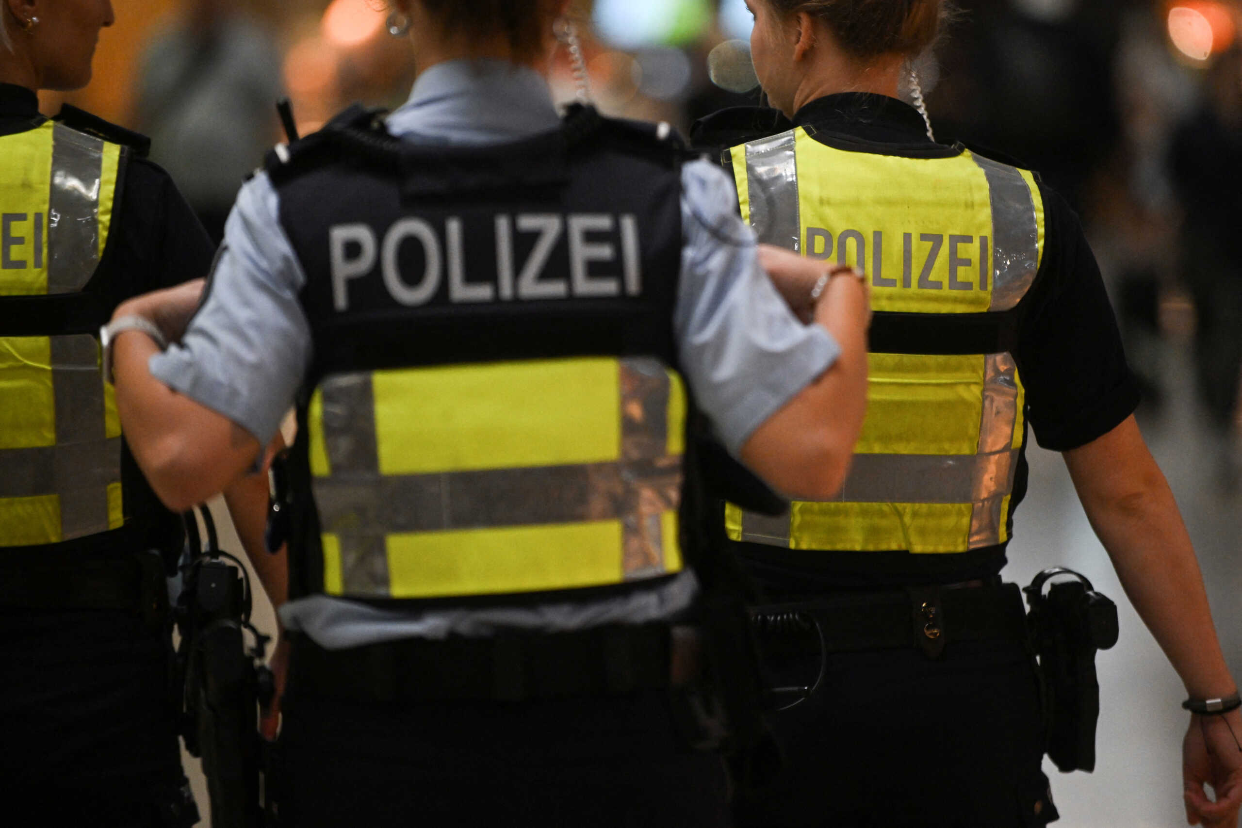 Police walk on the day activists of the "Letzte Generation" (Last Generation) protest for a change in climate policy at the Cologne-Bonn airport in Cologne, Germany July 24, 2024. REUTERS