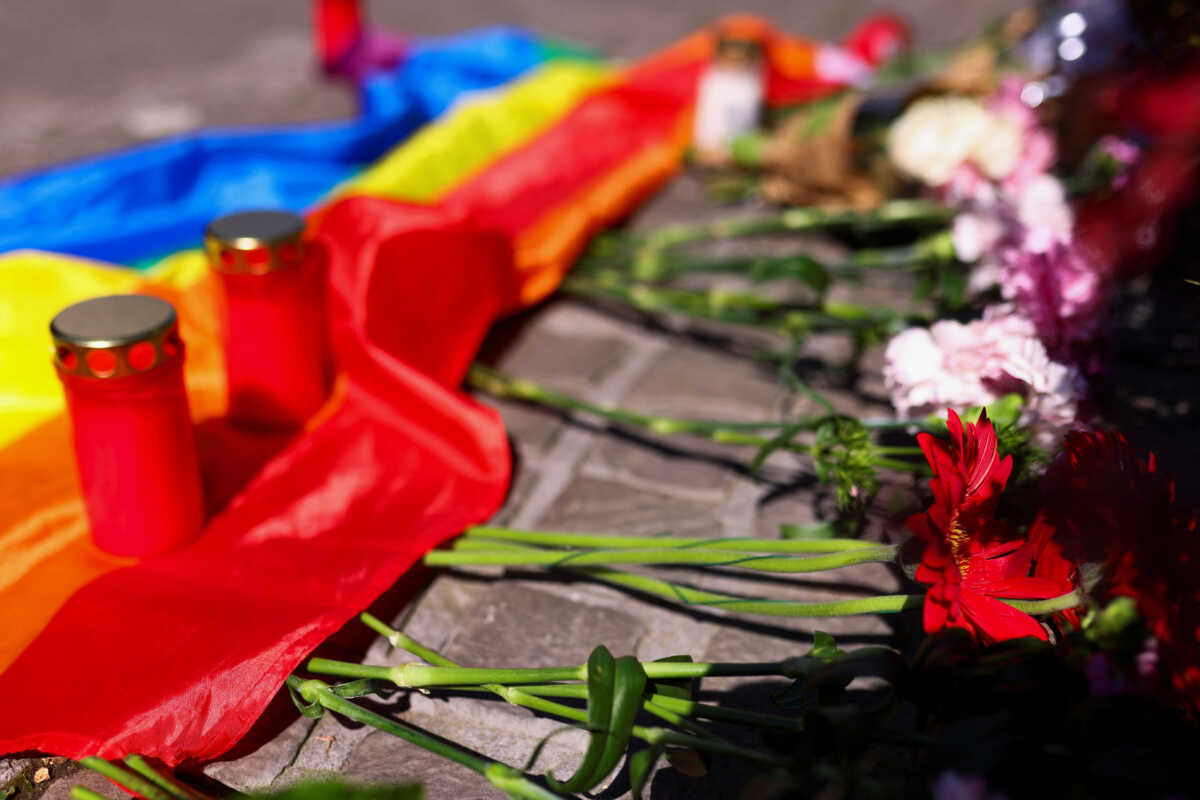 Flowers, candles and a rainbow flag are placed following an incident in which several individuals were killed after a man randomly stabbed passers-by with a knife at a city festival, in Solingen, Germany, August 24, 2024. REUTERS