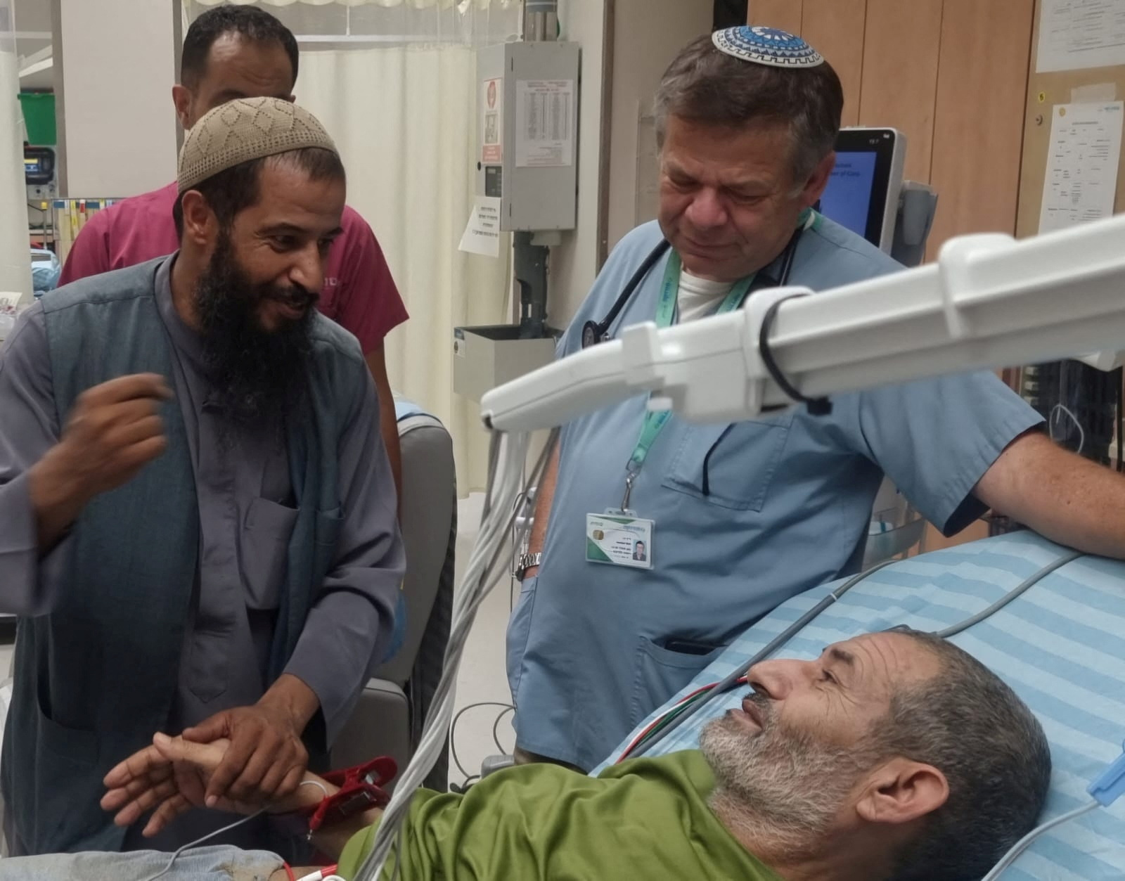 Qaid Farhan Alkadi, a Bedouin Israeli hostage who was kidnapped in the deadly October 7 Hamas attack, is greeted by a loved one after being rescued by Israeli forces at Soroka Medical Center in Beersheba, Israel, in this handout photo from August 27, 2024. Courtesy of Soroka Medical Center