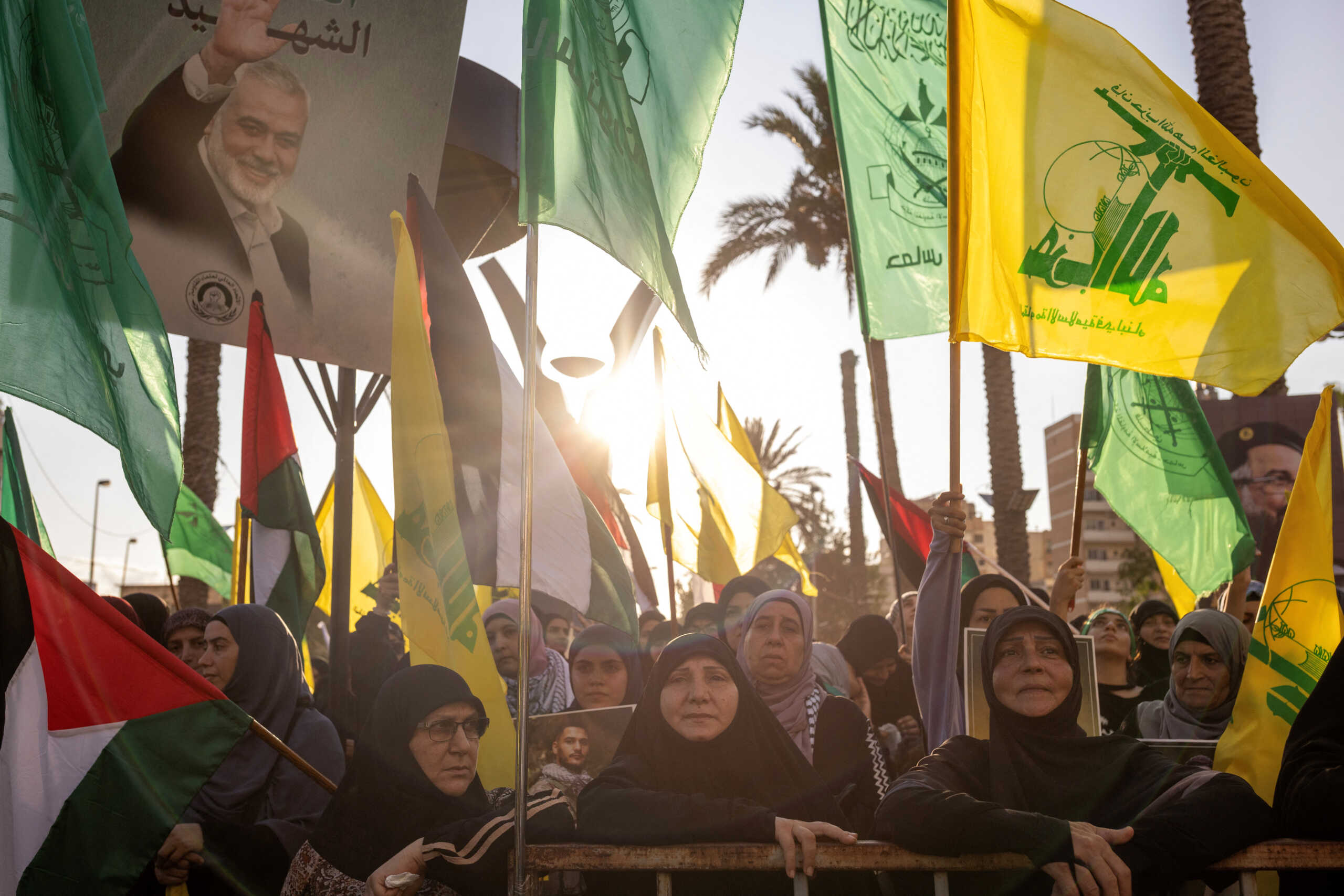 Supporters of Hamas and Hezbollah take part in a protest condemning the killing of Hamas leader Ismail Haniyeh and Hezbollah top commander Fuad Shukr, in Sidon, Lebanon, August 2, 2024. REUTERS