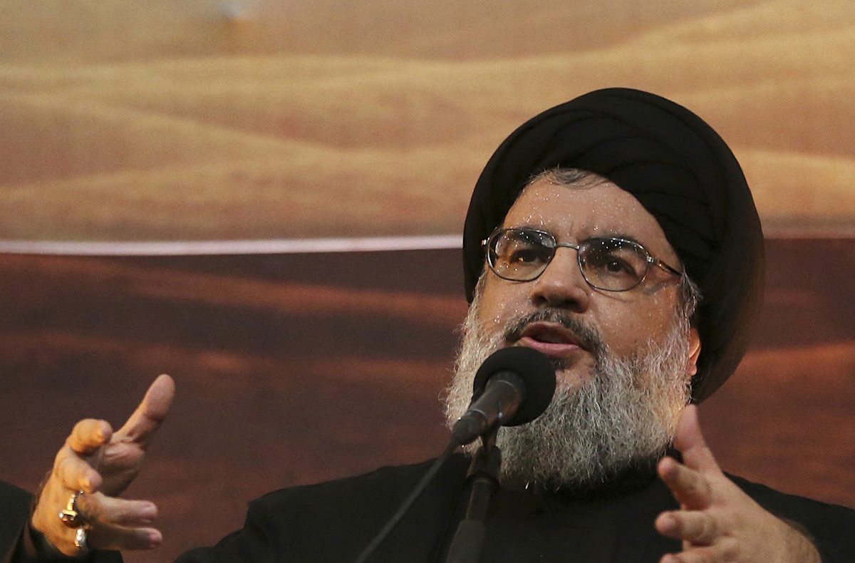 FILE -In this Nov. 3, 2014 file photo, Hezbollah leader Sheik Hassan Nasrallah addresses supporters ahead of the Shiite Ashura commemorations, in the southern suburb of Beirut, Lebanon. On Saturday, Jan. 26, 2019, the head of Lebanon's Hezbollah group is warning Israel of widening its attacks in Syria because a miscalculation can drag the region into a war. (AP Photo