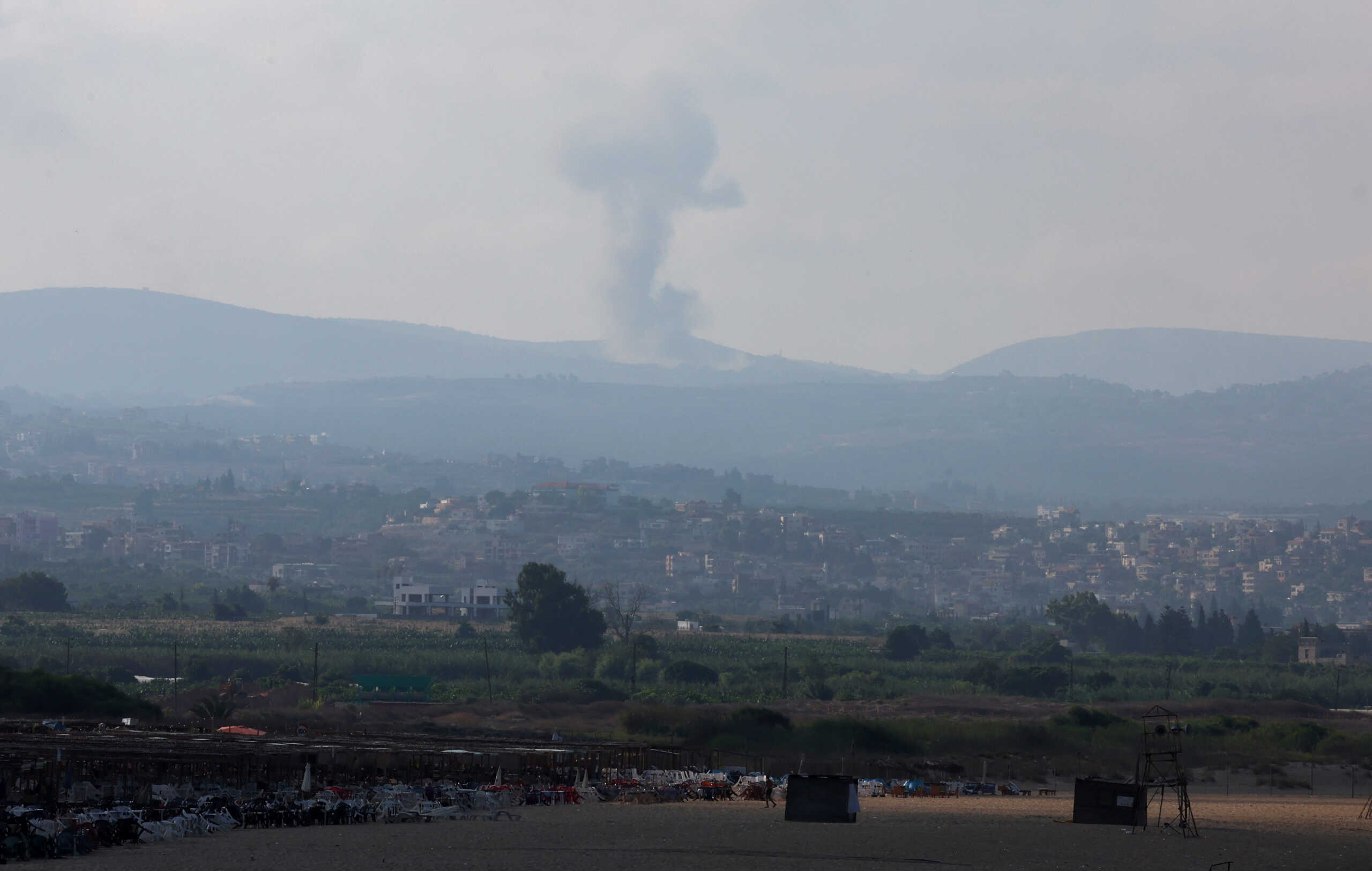 A view shows smoke on the Lebanese side of the border with Israel, amid ongoing cross-border hostilities between Hezbollah and Israeli forces, as seen from Tyre, southern Lebanon August 25, 2024. REUTERS