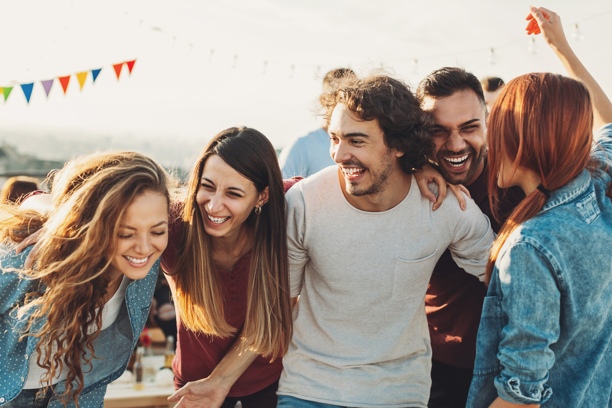 Multi-ethnic group of young people on a rooftop party