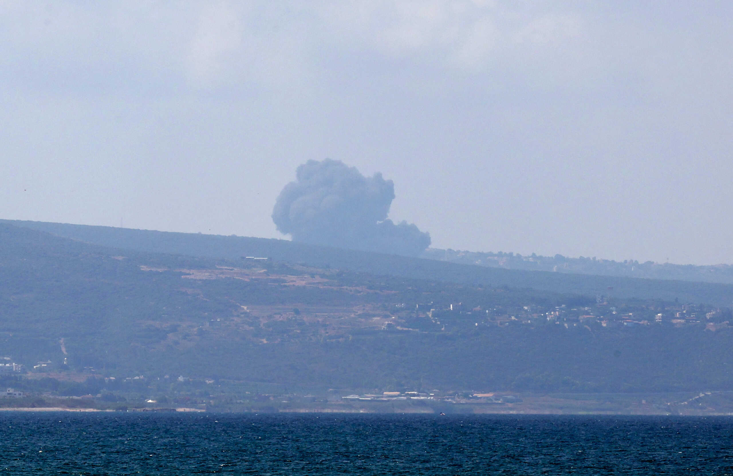 A view shows smoke on the Lebanese side of the border with Israel, amid ongoing cross-border hostilities between Hezbollah and Israeli forces, as seen from Tyre, southern Lebanon August 25, 2024. REUTERS