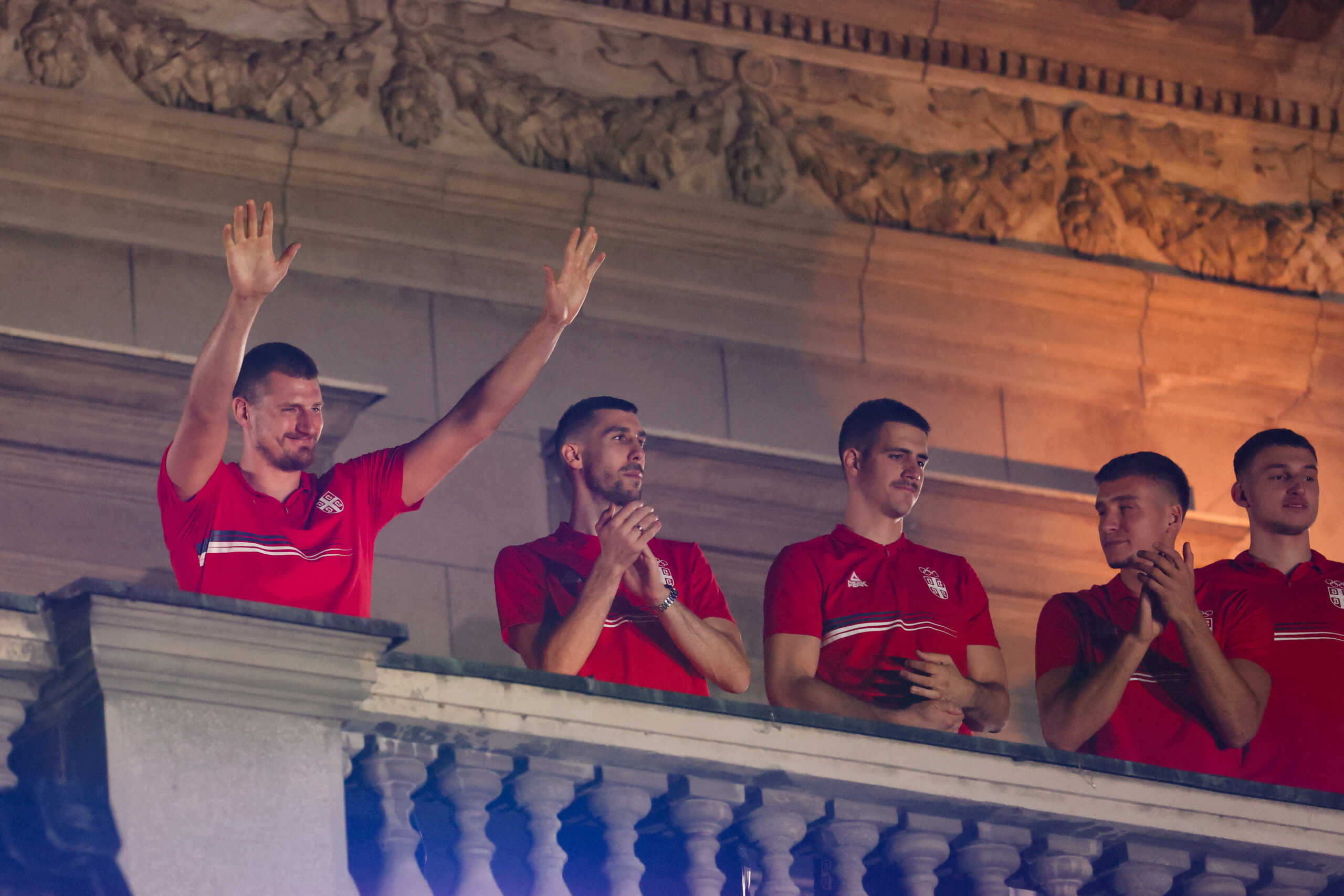Basketball player Nikola Jokic and members of Team Serbia react during the welcome ceremony for Serbian Olympic champions, in Belgrade, Serbia, August 12, 2024. REUTERS