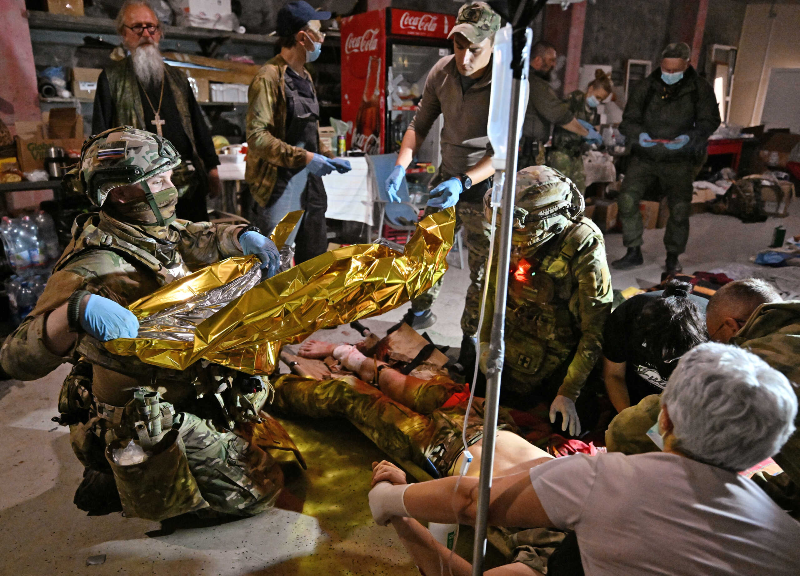 SENSITIVE MATERIAL. THIS IMAGE MAY OFFEND OR DISTURB Medics deliver medical aid at a mobile medical station, which was opened by volunteers to treat wounded Russian military personnel and local residents, following an incursion of Ukrainian troops in the course of Russia-Ukraine conflict in the Kursk region, Russia August 11, 2024. Kommersant Photo