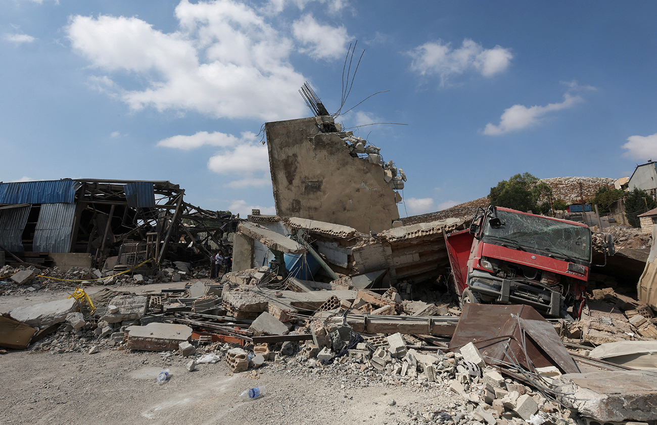 A view shows a damaged site in the aftermath of what Lebanon's state media said was an Israeli strike in al-kfour, Nabatieh, southern Lebanon August 17, 2024. REUTERS
