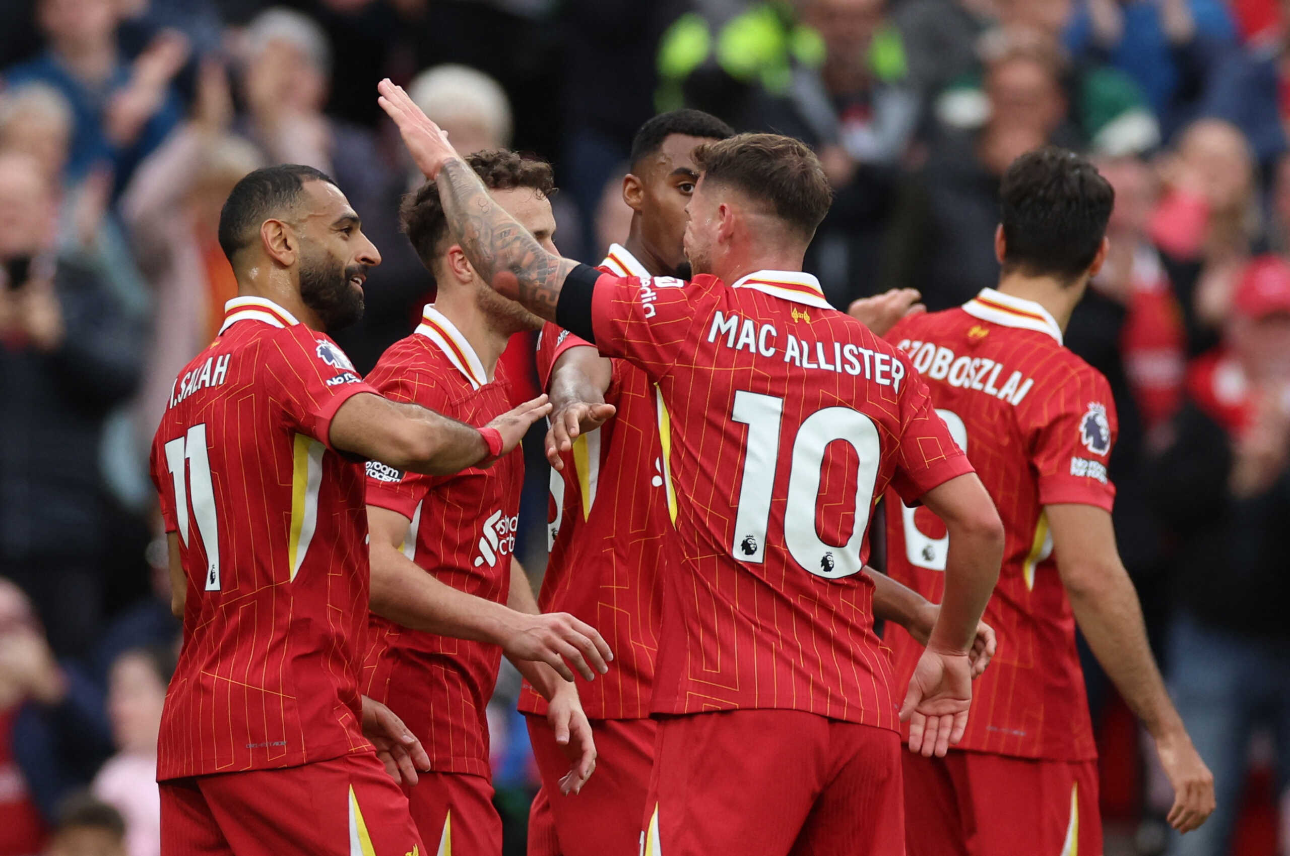 Soccer Football - Premier League - Liverpool v Brentford - Anfield, Liverpool, Britain - August 25, 2024 Liverpool's Mohamed Salah celebrates scoring their second goal with teammates REUTERS
