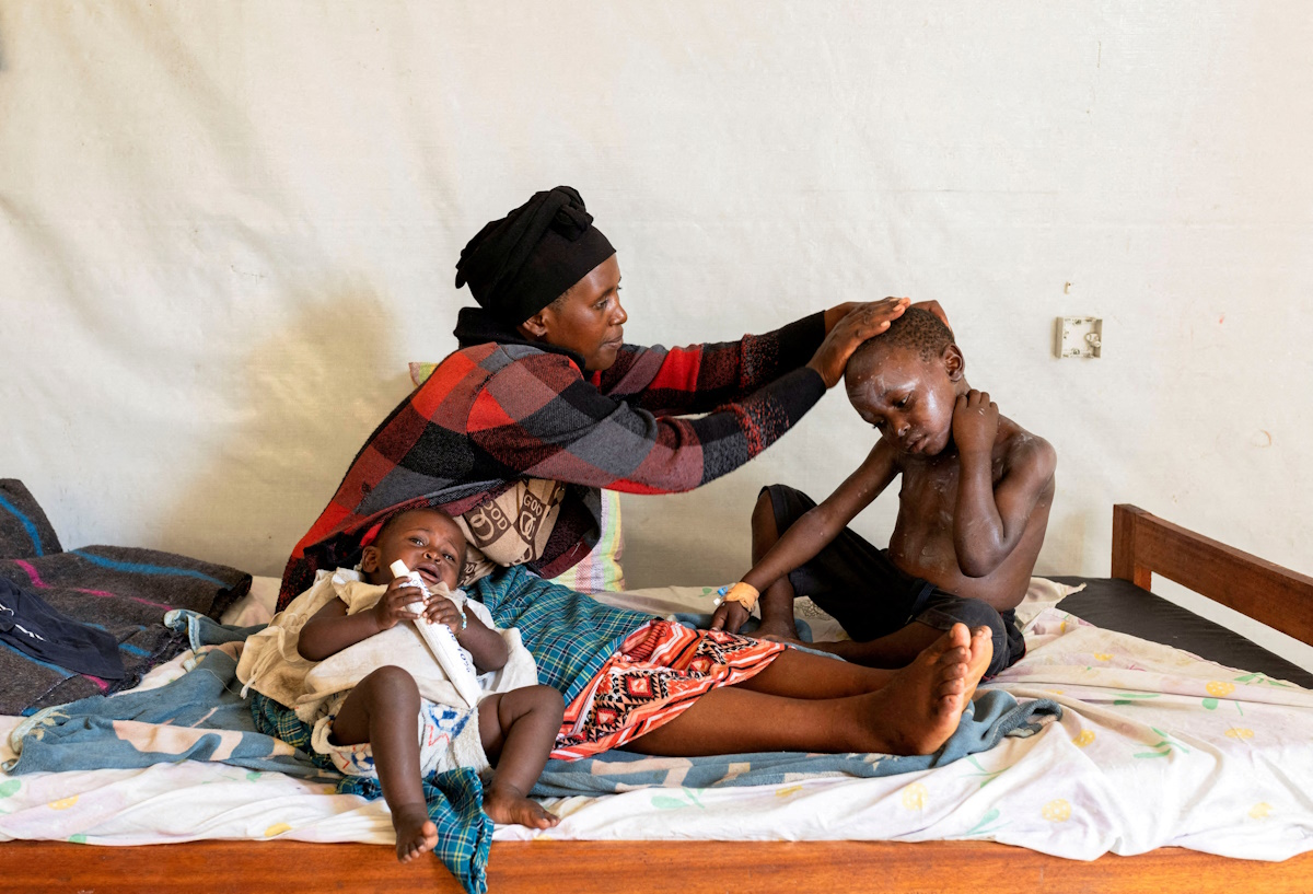 FILE PHOTO: Elisabeth Furaha applies medication on the skin of her child Sagesse Hakizimana who is under treatment for Mpox, an infectious disease caused by the Mpox virus that causes a painful rash, enlarged lymph nodes and fever, at a health centre in Munigi, Nyiragongo territory, near Goma in North Kivu province of the Democratic Republic of Congo August 19, 2024. REUTERS