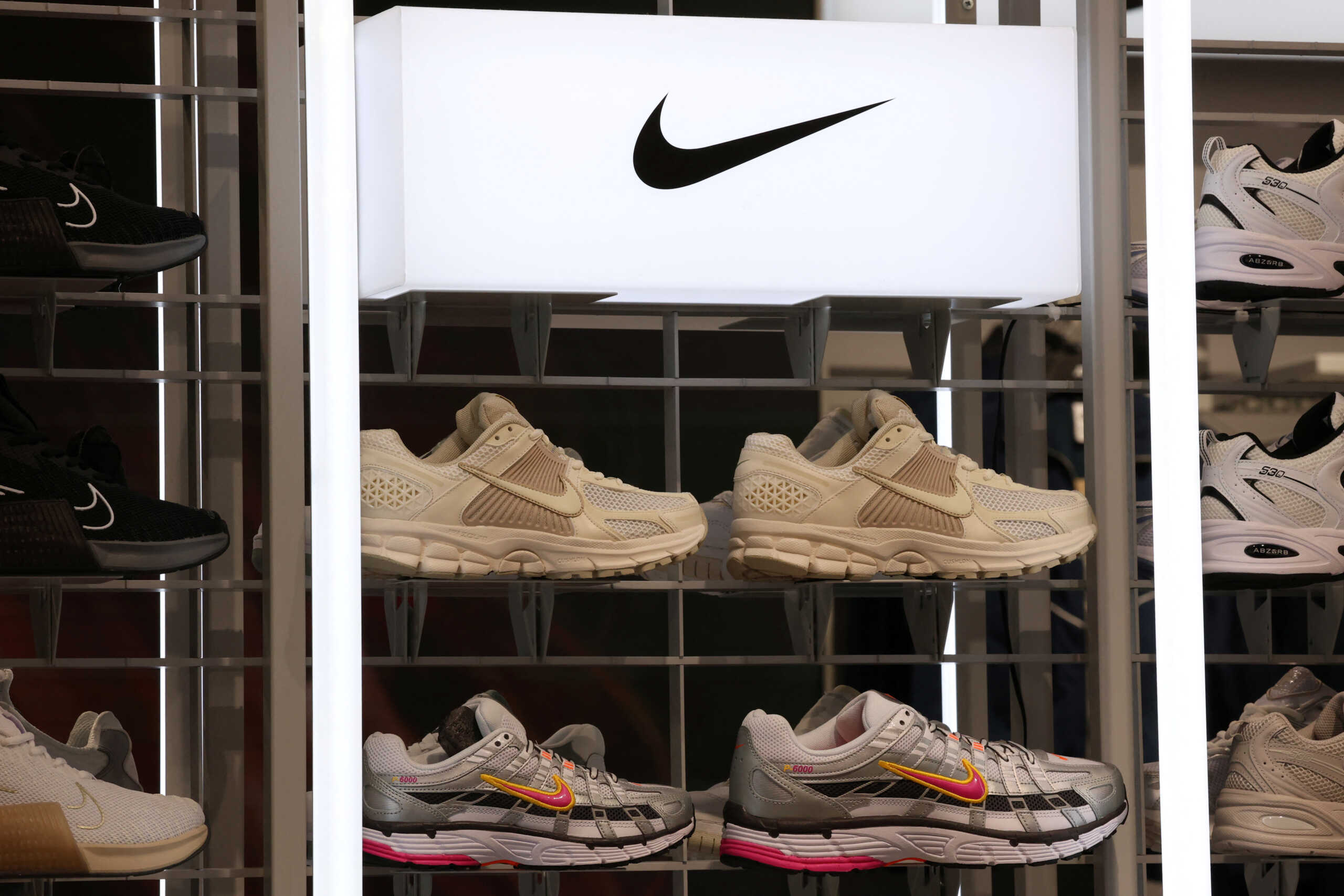 Nike sneakers are seen on display at the newly renovated JD Sports store at Westfield Stratford City in London, Britain, July 30. REUTERS