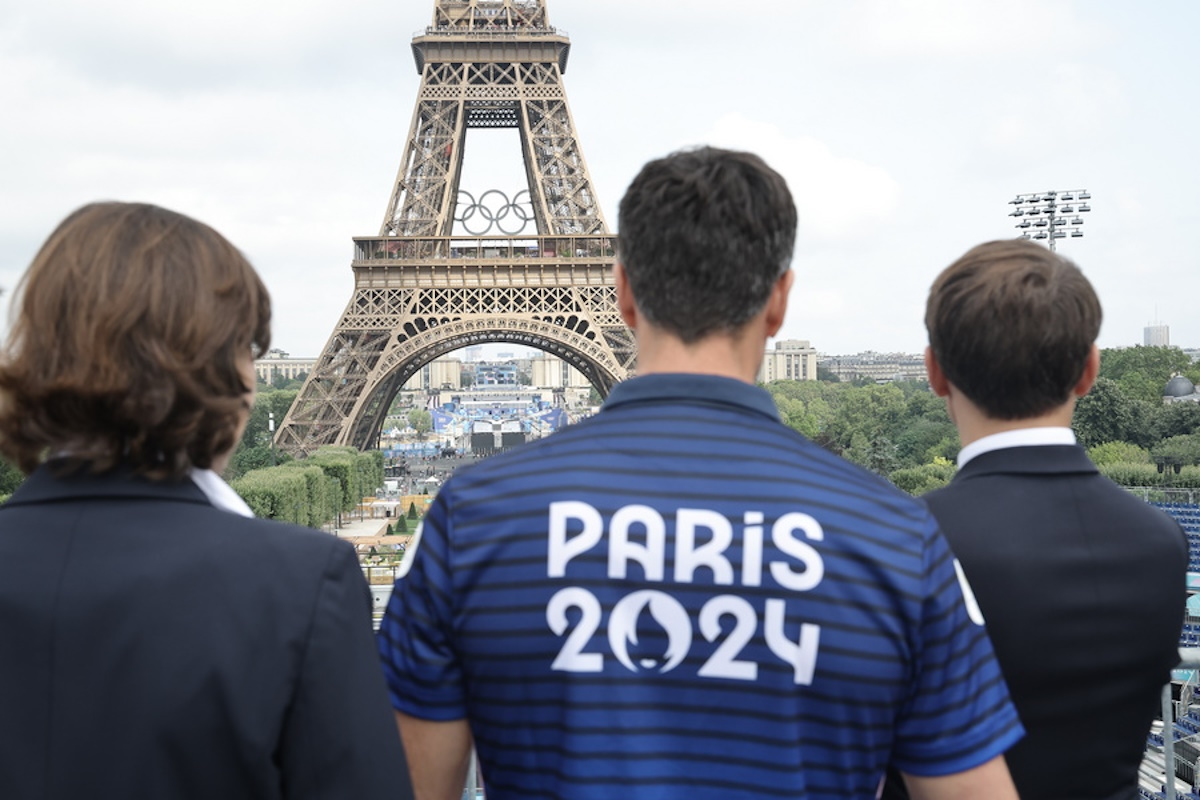 epa11493679 (R-L) French President Emmanuel Macron, President of the Paris 2024 Olympics and Paralympics Organizing Committee Tony Estanguet and France's Minister for Sports and Olympic and Paralympic Games Amelie Oudea-Castera visit the 'Stade Tour Eiffel' in Champs de Mars in Paris, France, 24 July 2024. 'Stade Tour Eiffel' will host beach volleyball and blind football during the 2024 Summer Olympics which will be held in Paris from 26 July to 11 August 2024 and the Paralympic Games from 28 August to 08 September 2024.  EPA
