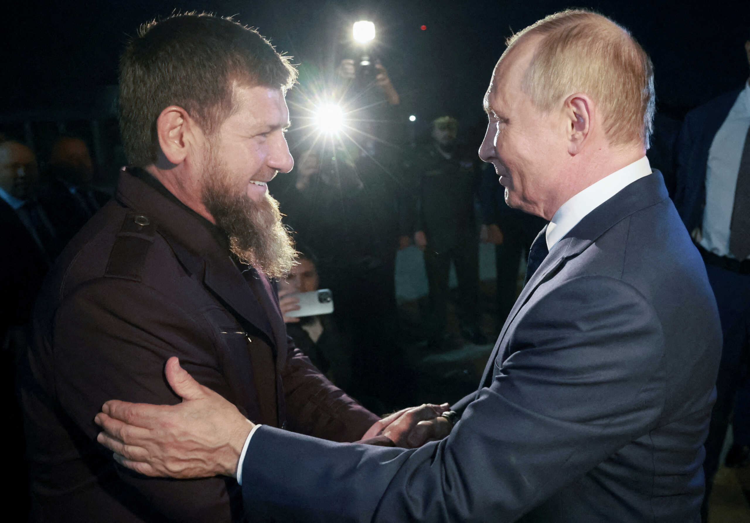 Russia's President Vladimir Putin is welcomed by head of the Chechen Republic Ramzan Kadyrov as they meet at an airport in Grozny, Russia August 20, 2024. Sputnik