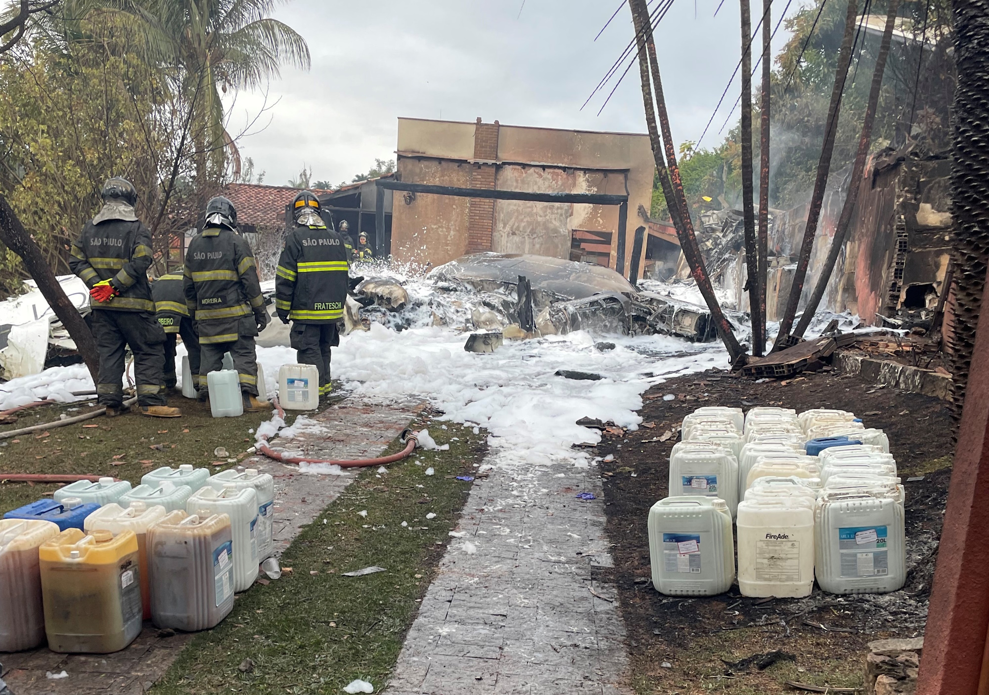 Debris is pictured as emergency personnel work at the site of a turboprop plane crash, in Vinhedo, Brazil August 9, 2024  in this picture obtained from social media. Juninho Giugni via Instagram