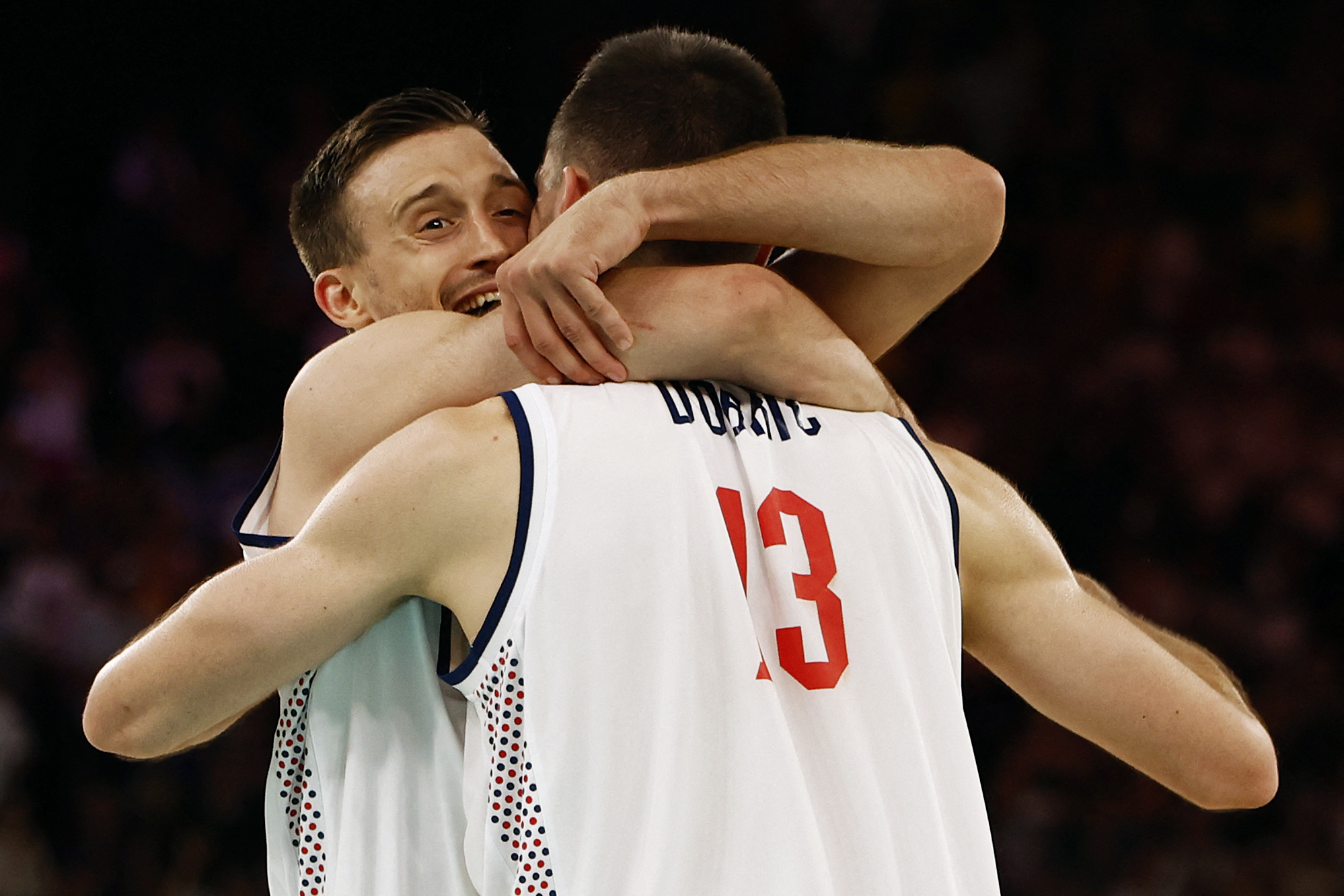 Paris 2024 Olympics - Basketball - Men's Quarterfinal - Serbia vs Australia - Bercy Arena, Paris, France - August 06, 2024. Aleksa Avramovic of Serbia celebrates the team's win with Ognjen Dobric of Serbia REUTERS