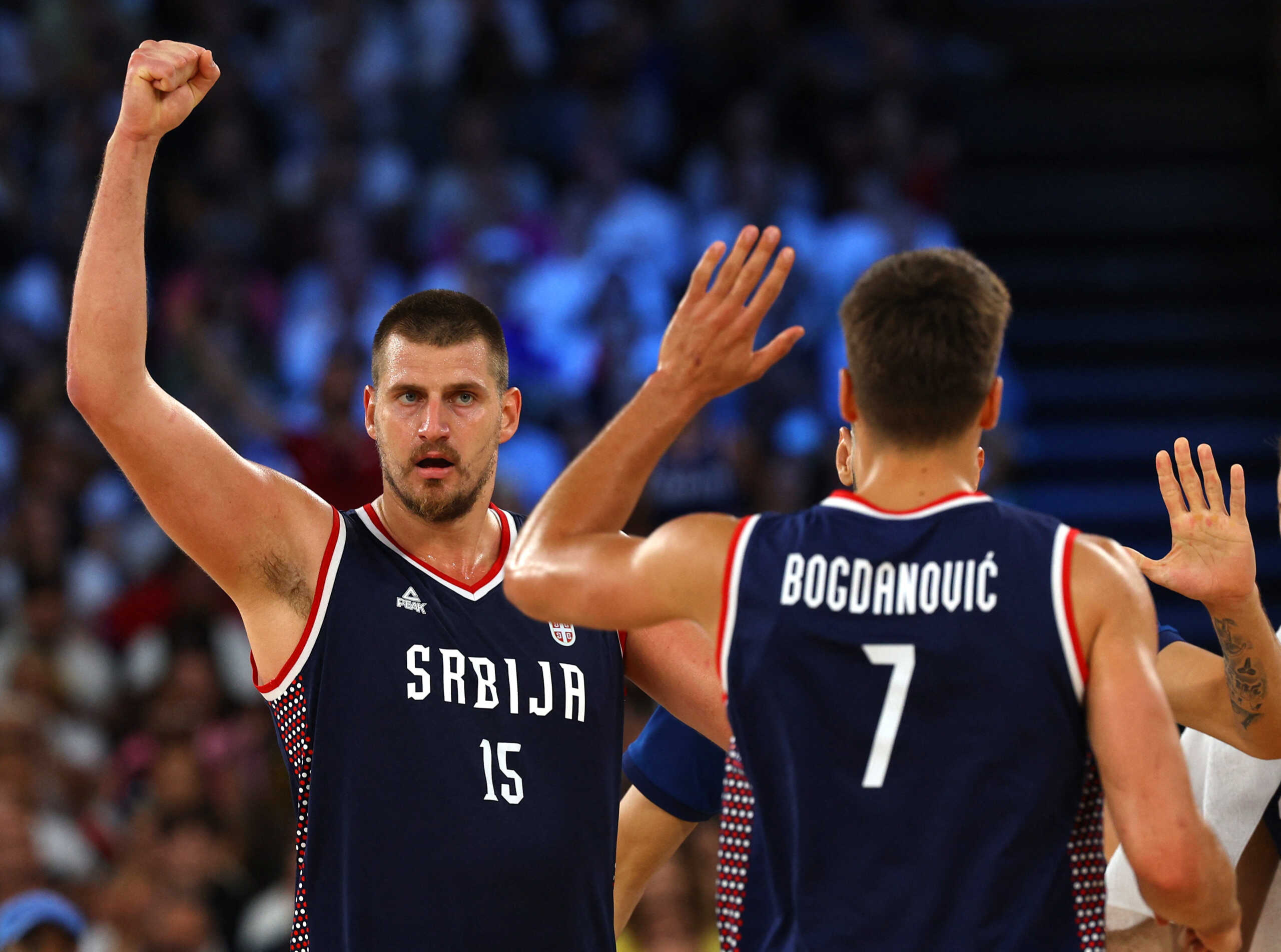 Paris 2024 Olympics - Basketball - Men's Bronze Medal Game - Germany vs Serbia - Bercy Arena, Paris, France - August 10, 2024. Nikola Jokic of Serbia and Bogdan Bogdanovic of Serbia celebrate during the match. REUTERS