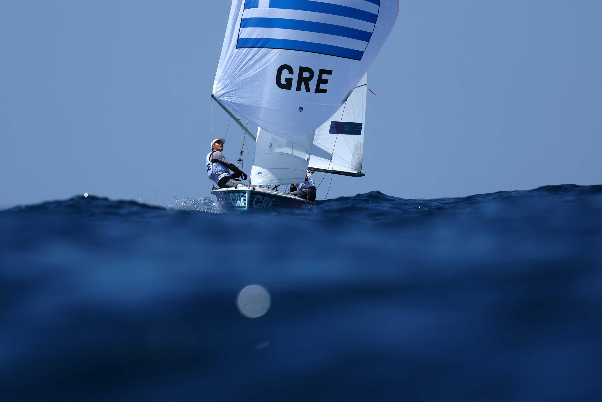 Paris 2024 Olympics - Sailing - Mixed Dinghy - Marseille Marina, Marseille, France - August 04, 2024. Ariadni Paraskevi Spanaki of Greece and Odysseas Emmanouil Spanakis of Greece in action. REUTERS