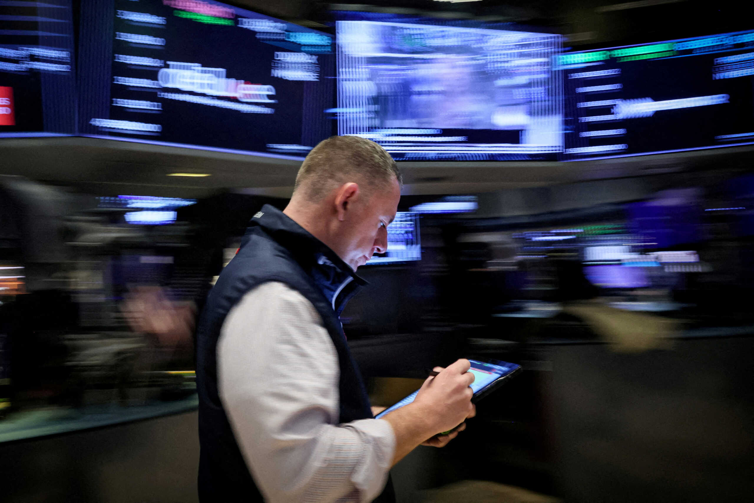 FILE PHOTO: A trader works on the floor at the New York Stock Exchange (NYSE) in New York City, U.S., March 7, 2024.  REUTERS
