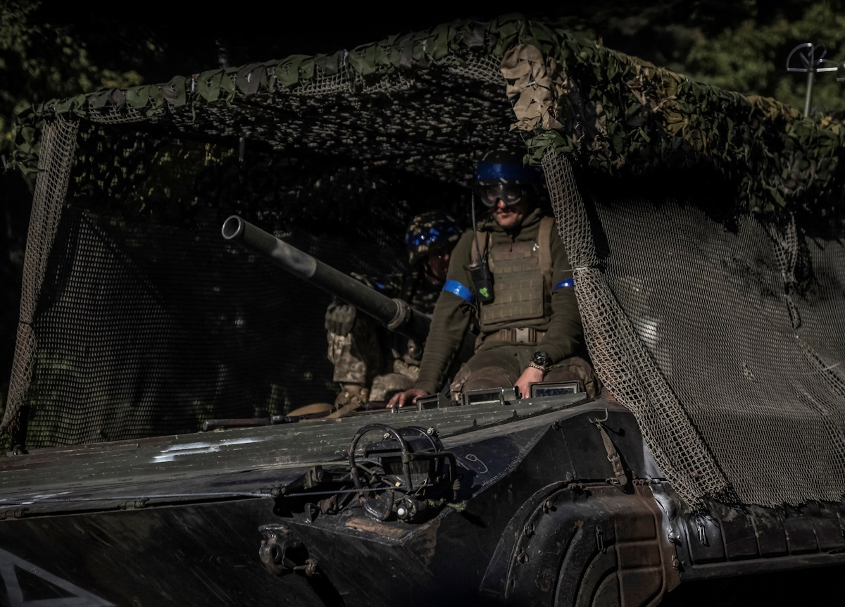 Ukrainian servicemen ride a BMP-1 infantry fighting vehicle, amid Russia's attack on Ukraine, near the Russian border in Sumy region, Ukraine August 14, 2024. REUTERS