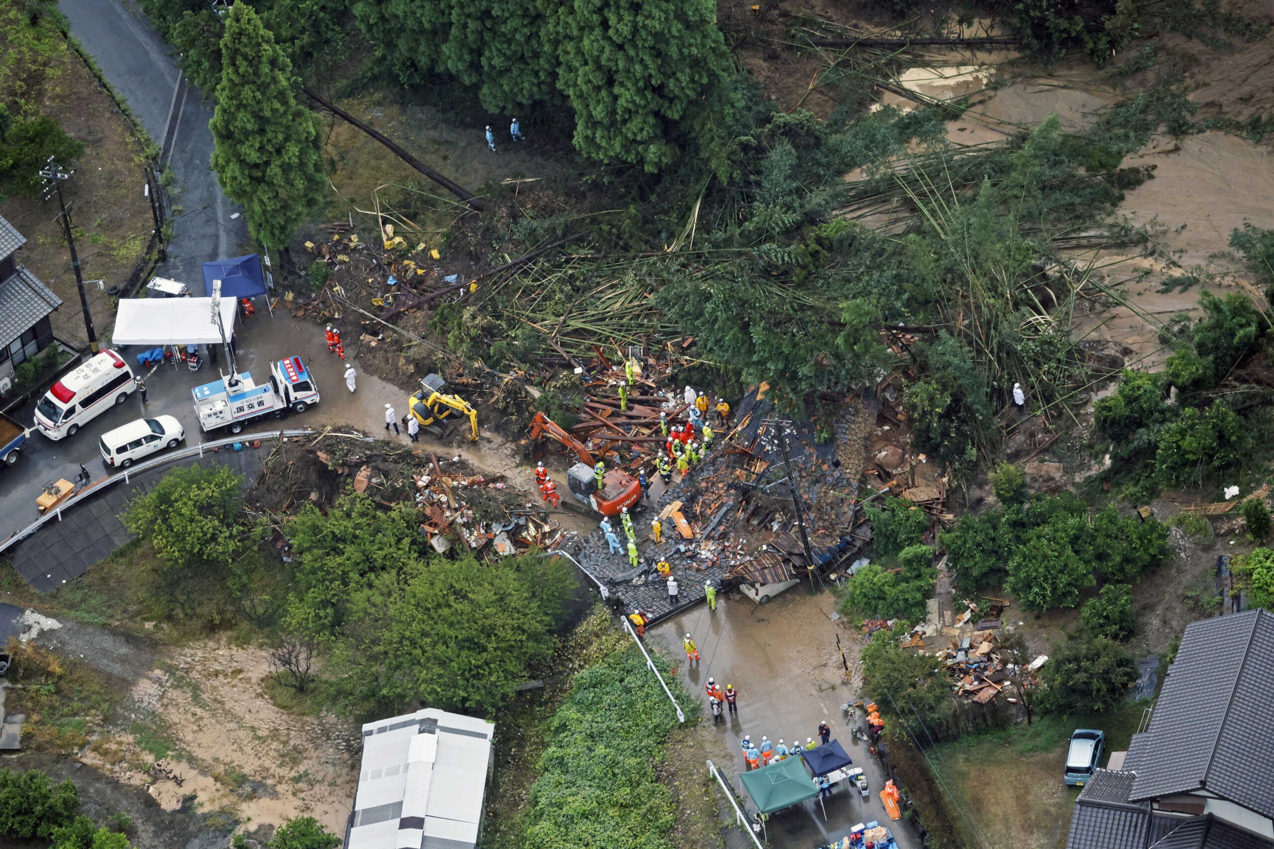 An aerial view shows rescue workers conducting search and rescue operation at a landslide site caused by a heavy rain due to the approach of Typhoon Shanshan in Gamagori, Aichi Prefecture, central Japan August 28, 2024, in this photo taken by Kyodo. Mandatory credit Kyodo