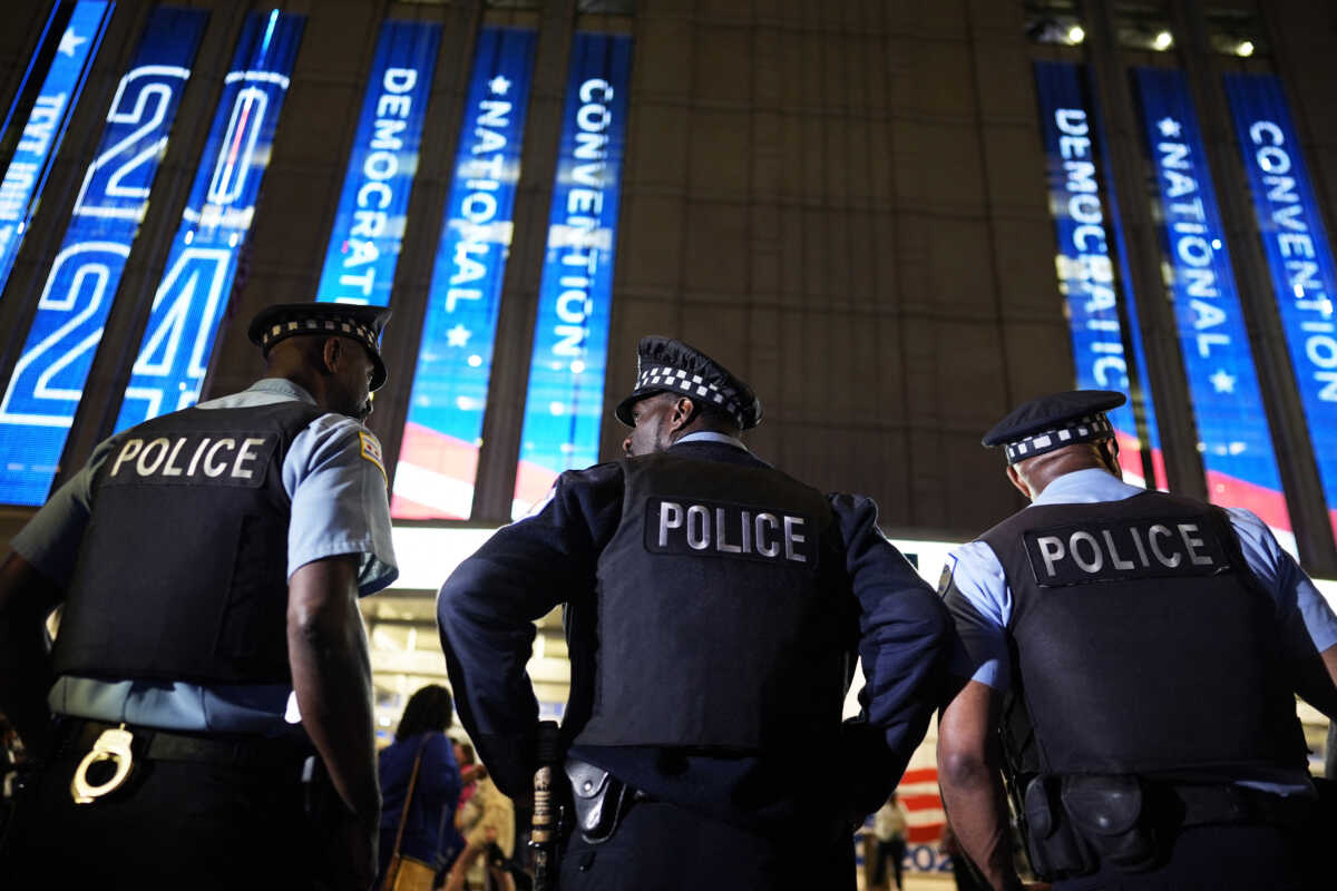 Police officers stand guard outside the venue on Day 3 of the Democratic National Convention (DNC) at the United Center, in Chicago, Illinois, U.S., August 21, 2024. REUTERS