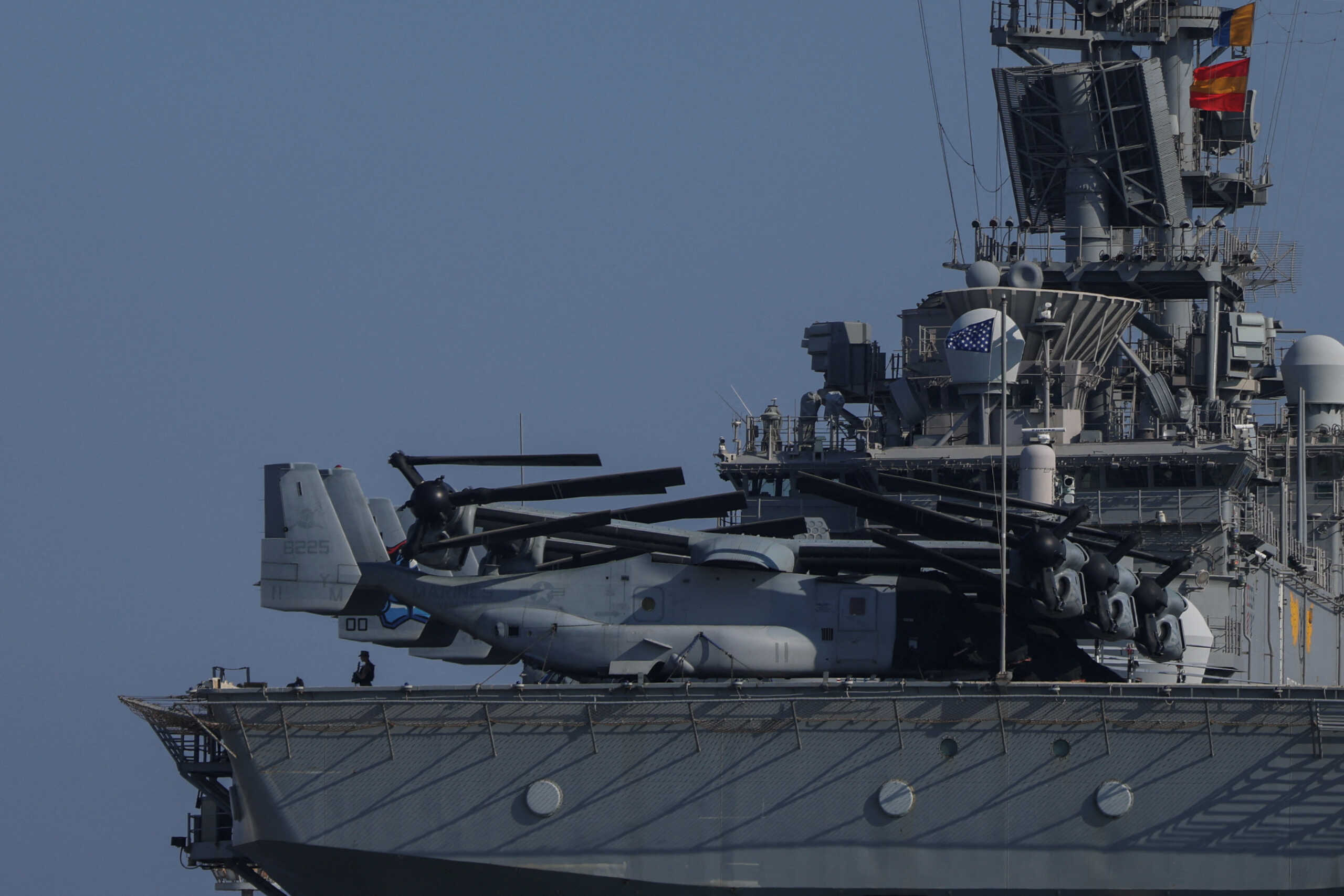 A member of the crew stands guard onboard the amphibious assault ship USS Wasp (LHD-1), as it is docked in Limassol port, amid rising tensions in the Middle East, in Limassol, Cyprus, August 10, 2024. REUTERS