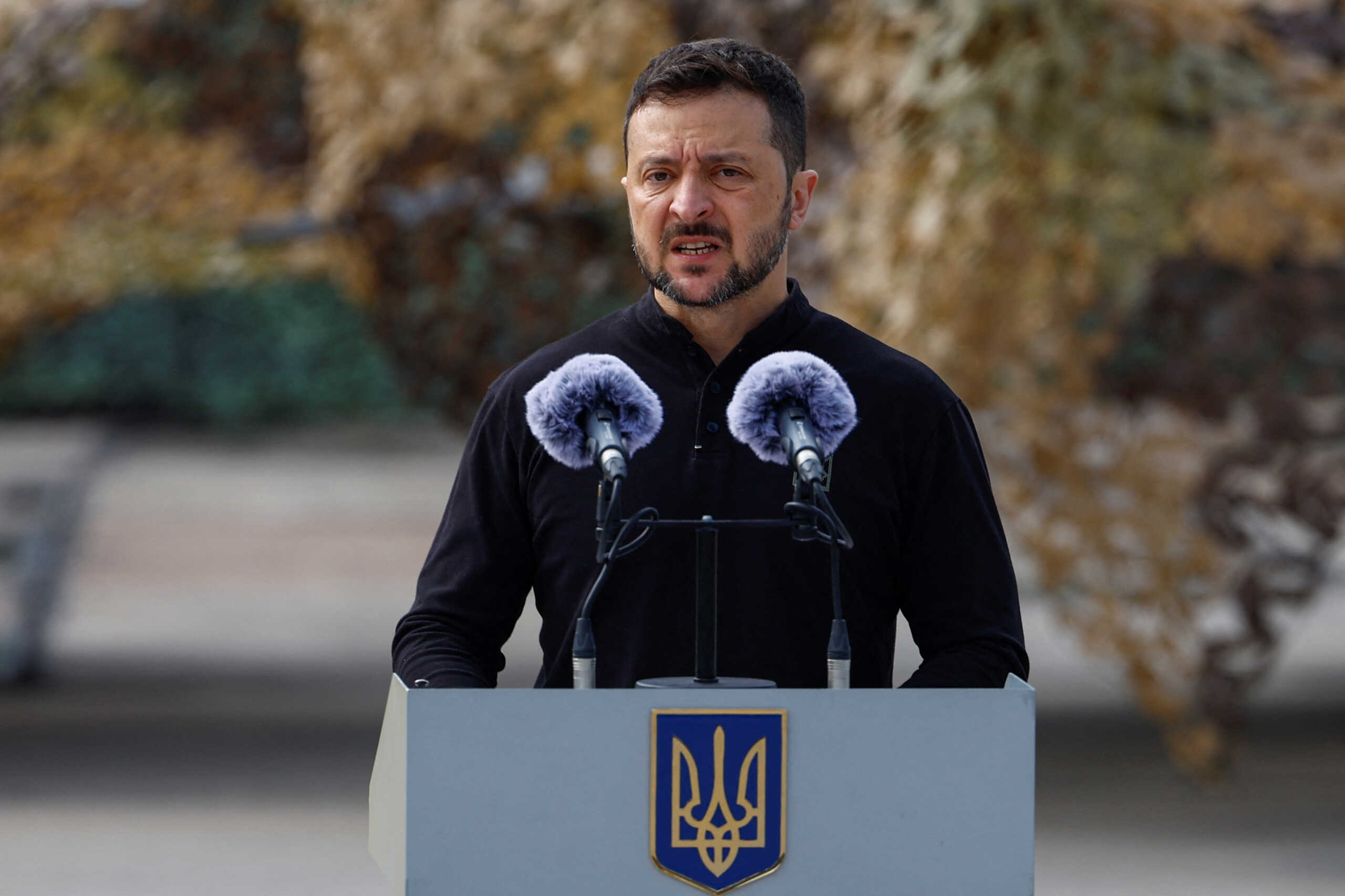 Ukraine's President Volodymyr Zelenskiy speaks to service members next to F-16 fighting aircrafts during marking the Day of the Ukrainian Air Forces, amid Russia's attack on Ukraine, in an undisclosed location, Ukraine August 4, 2024. REUTERS