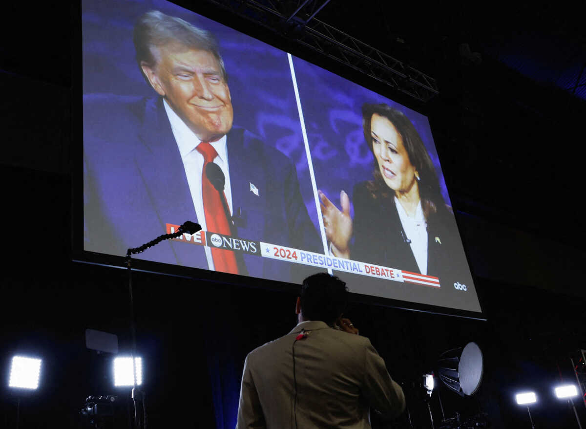 A screen displays the presidential debate hosted by ABC between Republican presidential nominee, former U.S. President Donald Trump and Democratic presidential nominee, U.S. Vice President Kamala Harris in Philadelphia, Pennsylvania, U.S., September 10, 2024. REUTERS