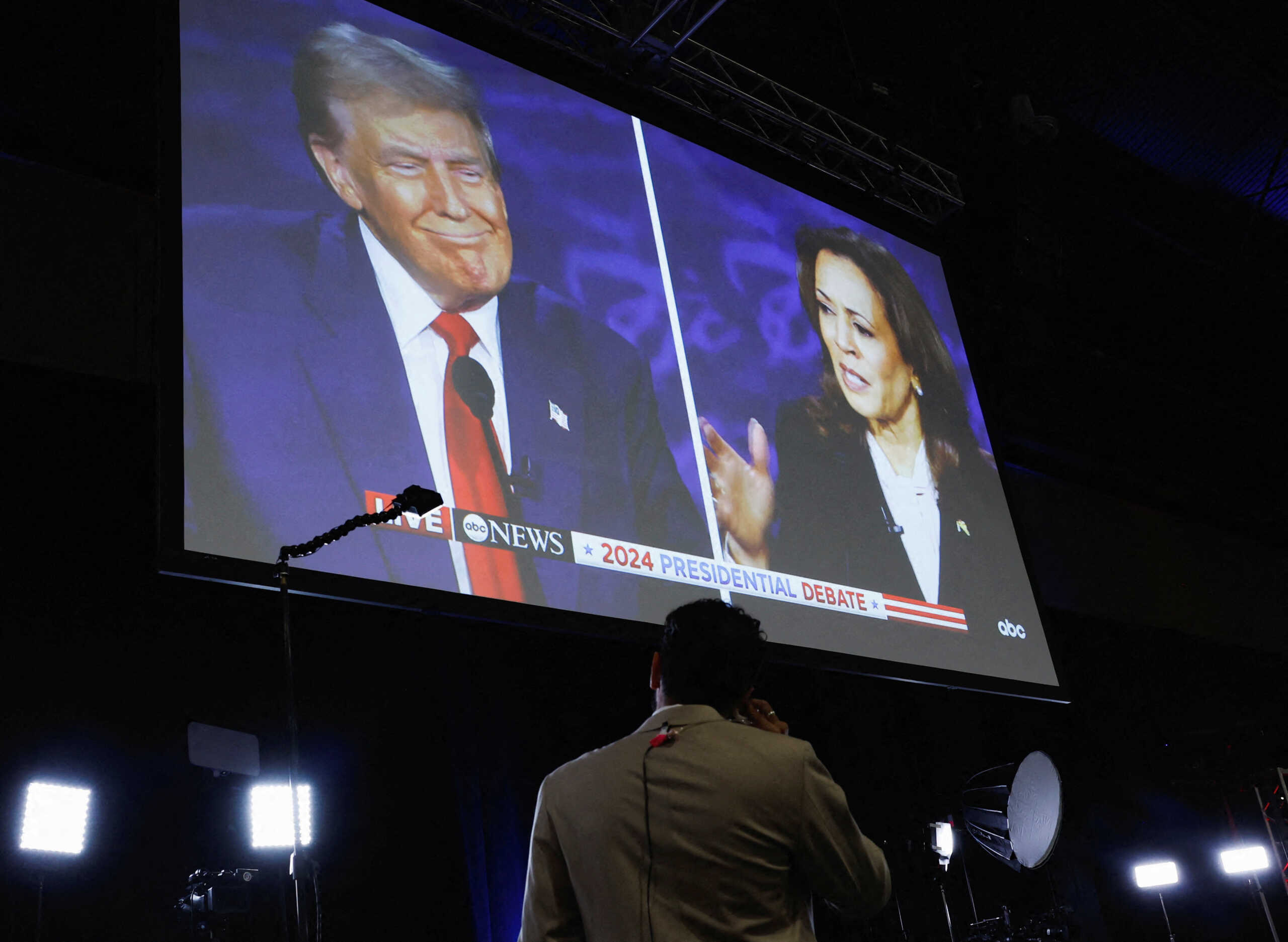 A screen displays the presidential debate hosted by ABC between Republican presidential nominee, former U.S. President Donald Trump and Democratic presidential nominee, U.S. Vice President Kamala Harris in Philadelphia, Pennsylvania, U.S., September 10, 2024. REUTERS