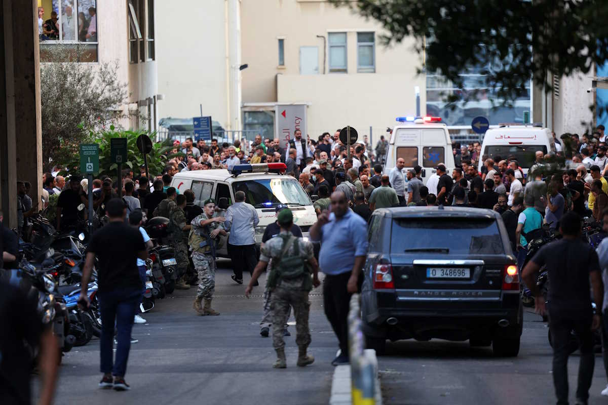 People gather outside a hospital as more than 1,000 people, including Hezbollah fighters and medics, were wounded when the pagers they use to communicate exploded across Lebanon, according to a security source, in Beirut, Lebanon September 17, 2024. REUTERS