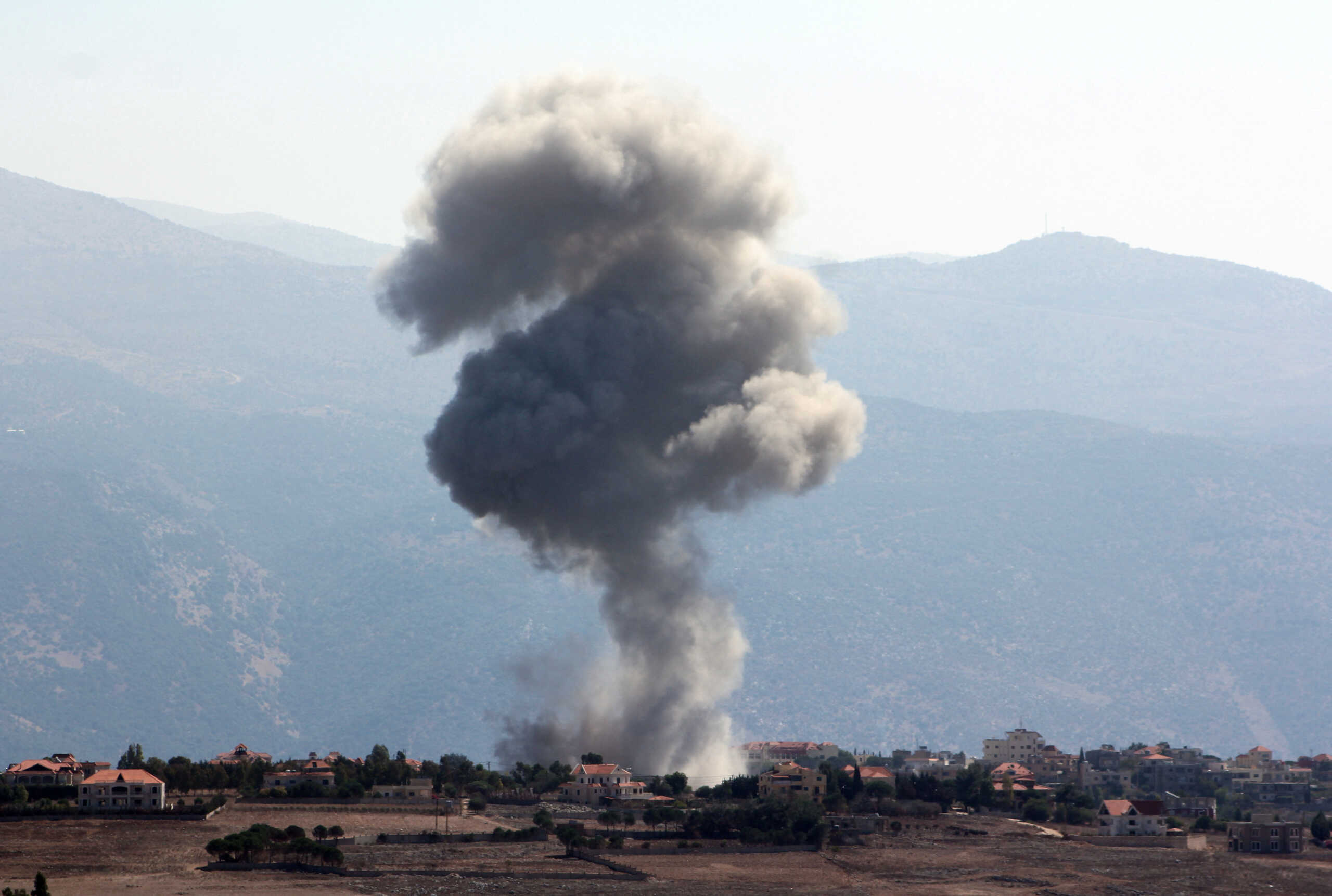 Smoke billows over Khiam, amid ongoing cross-border hostilities between Hezbollah and Israeli forces, as pictured from Marjayoun, near the Lebanese border with Israel, September 30, 2024. REUTERS