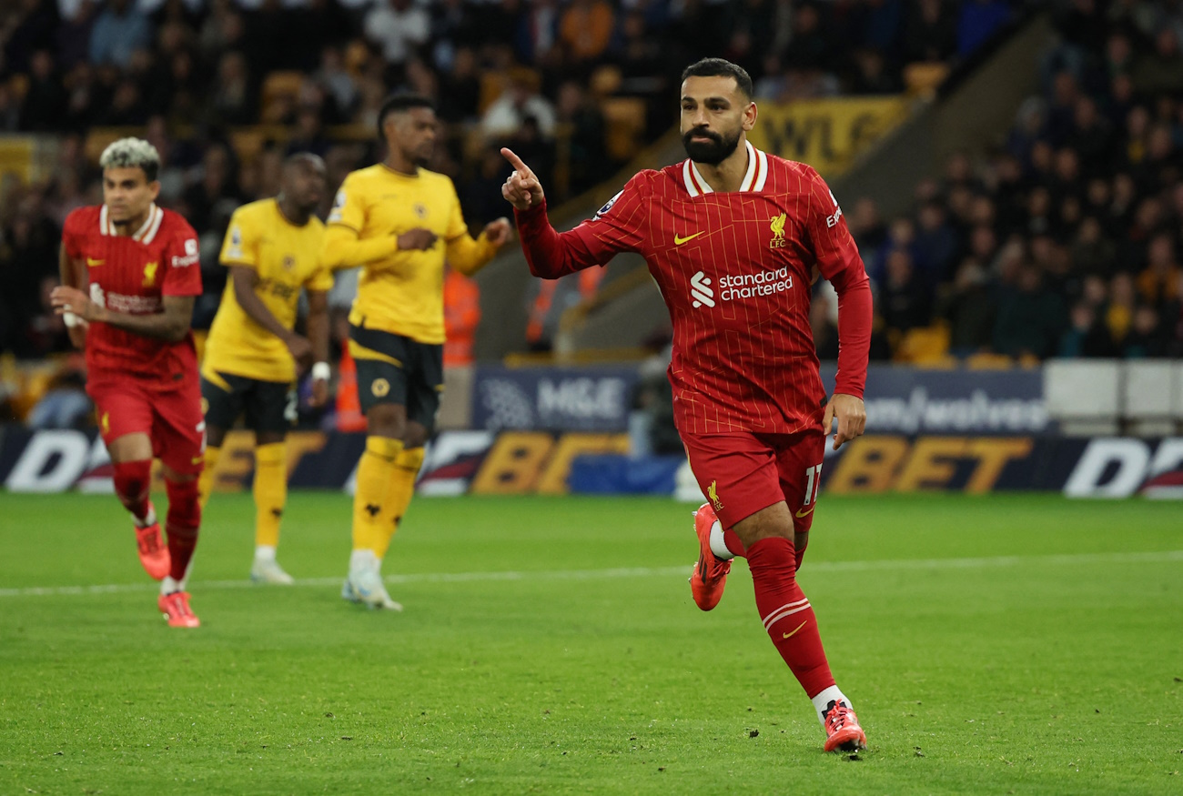 Soccer Football - Premier League - Wolverhampton Wanderers v Liverpool - Molineux Stadium, Wolverhampton, Britain - September 28, 2024 Liverpool's Mohamed Salah celebrates scoring their second goal REUTERS
