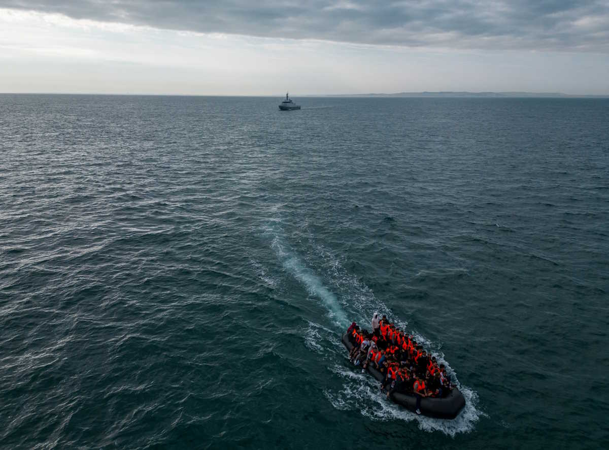 In this drone view an inflatable dinghy carrying migrants makes its way towards England in the English Channel, Britain, August 6, 2024. REUTERS