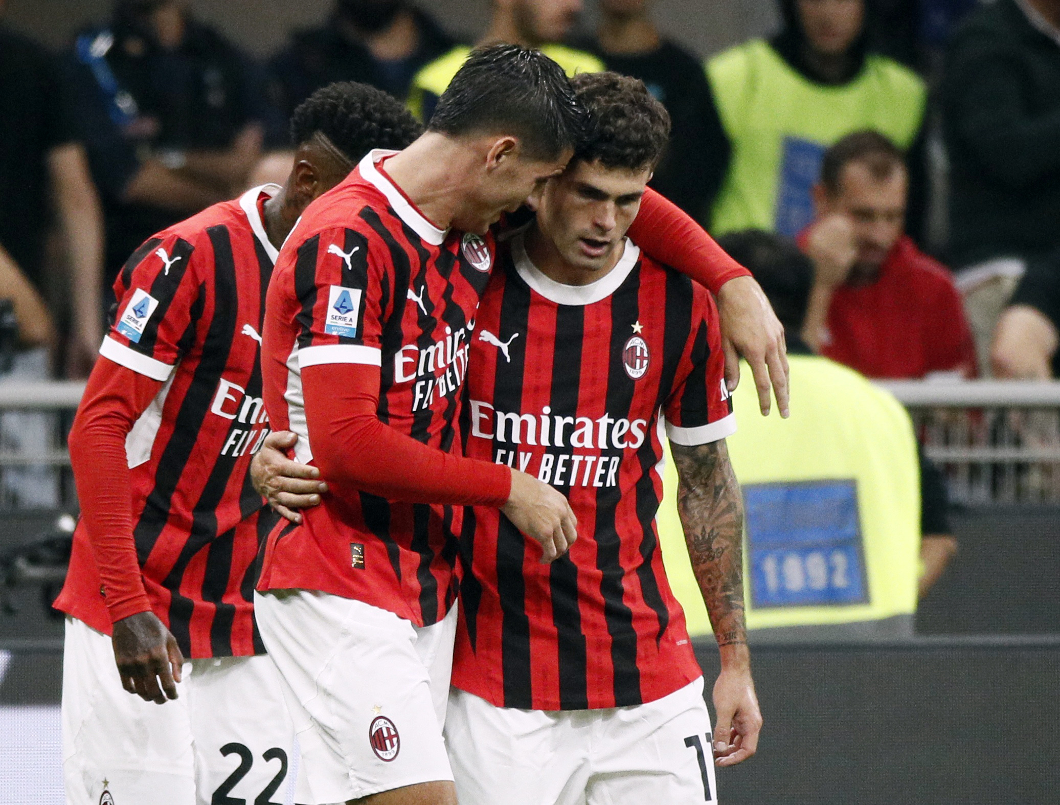 Soccer Football - Serie A - Inter Milan v AC Milan - San Siro, Milan, Italy - September 22, 2024 AC Milan's Christian Pulisic celebrates scoring their first goal with teammates REUTERS