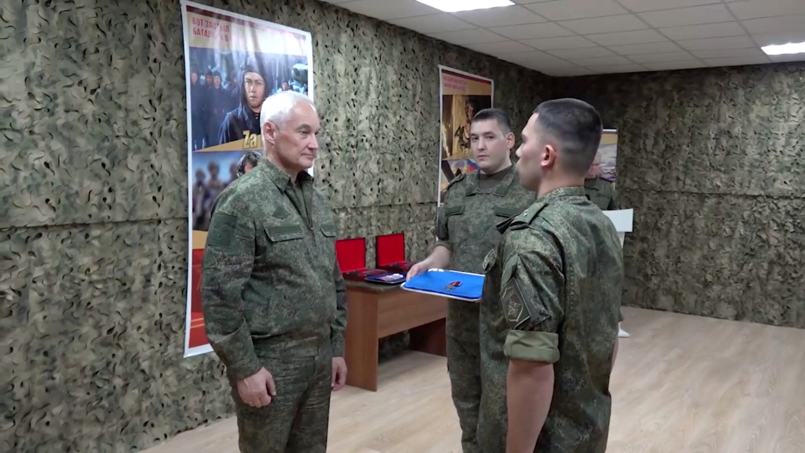 Russian Defence Minister Andrei Belousov awards a service member as he inspects Russian troops involved in Russia-Ukraine conflict, at an undisclosed location, in this still image taken from video released September 11, 2024. Russian Defence Ministry